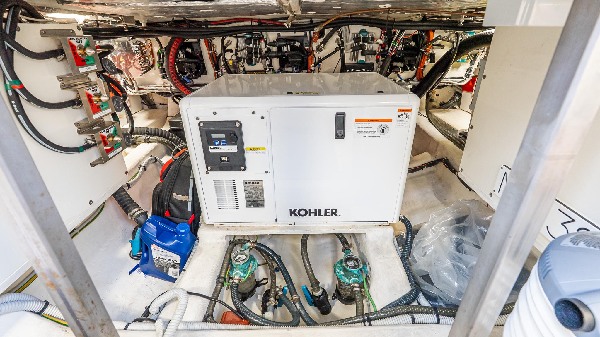 Engine room of 2023 Pardo Yachts 38 with Kohler generator and wiring.