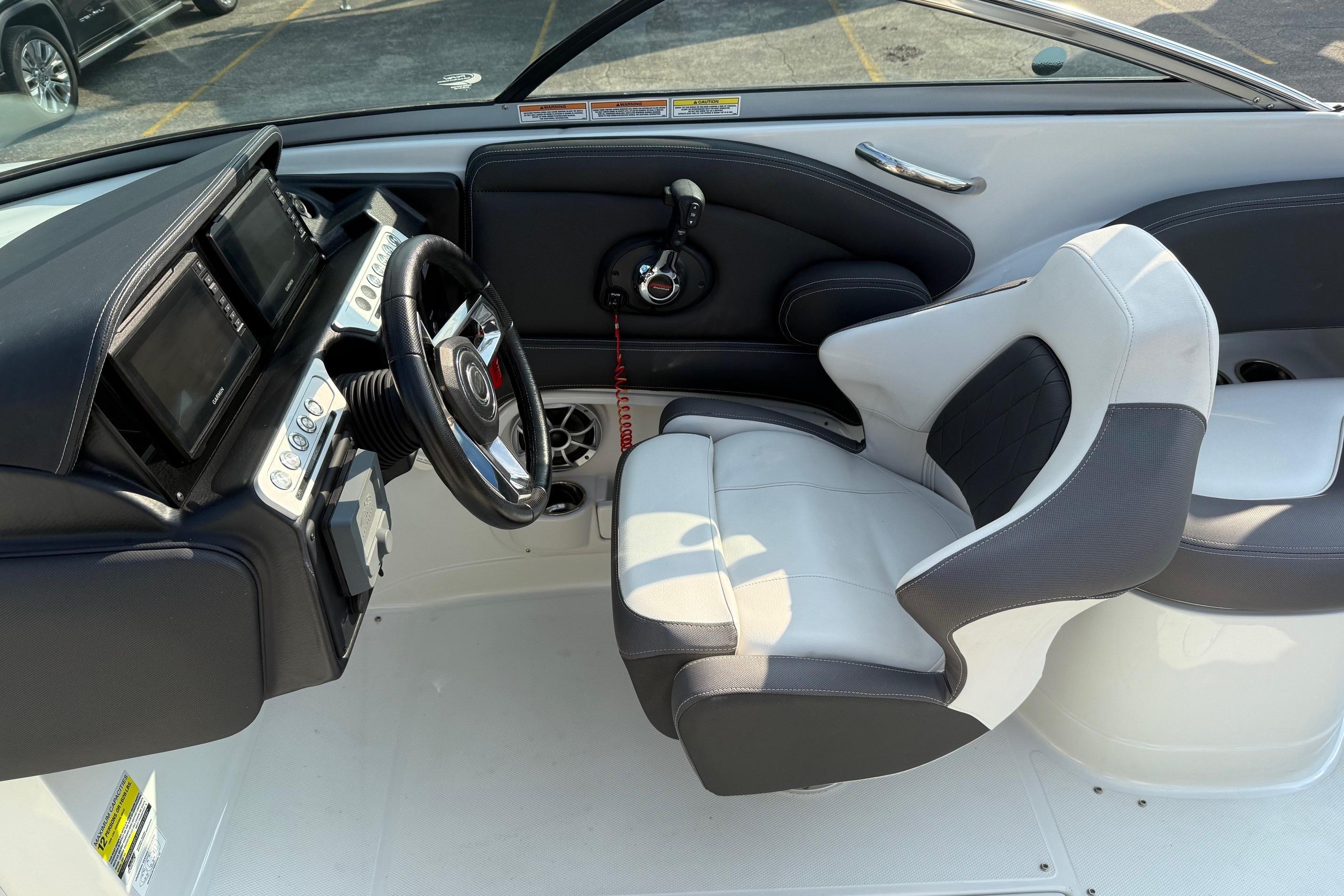 2023 Crownline 260 SS boat interior with modern dashboard and comfortable seating.