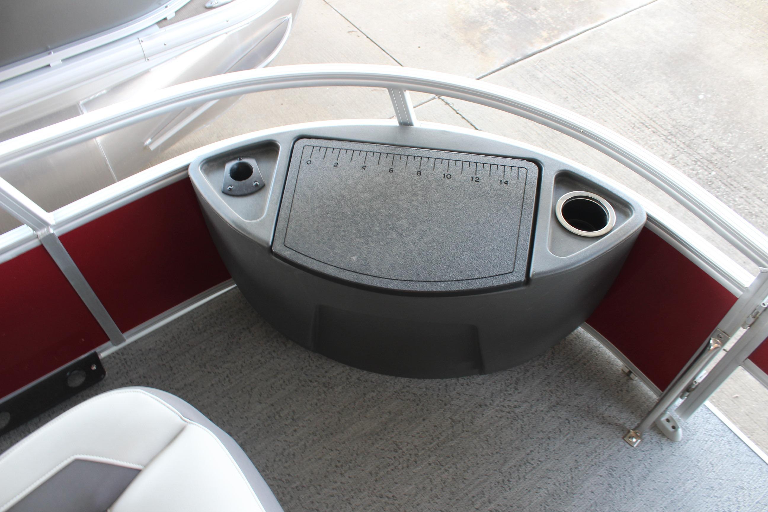 2026 Sun Tracker Bass Buggy 18 DLX boat console with cup holder and measuring board.