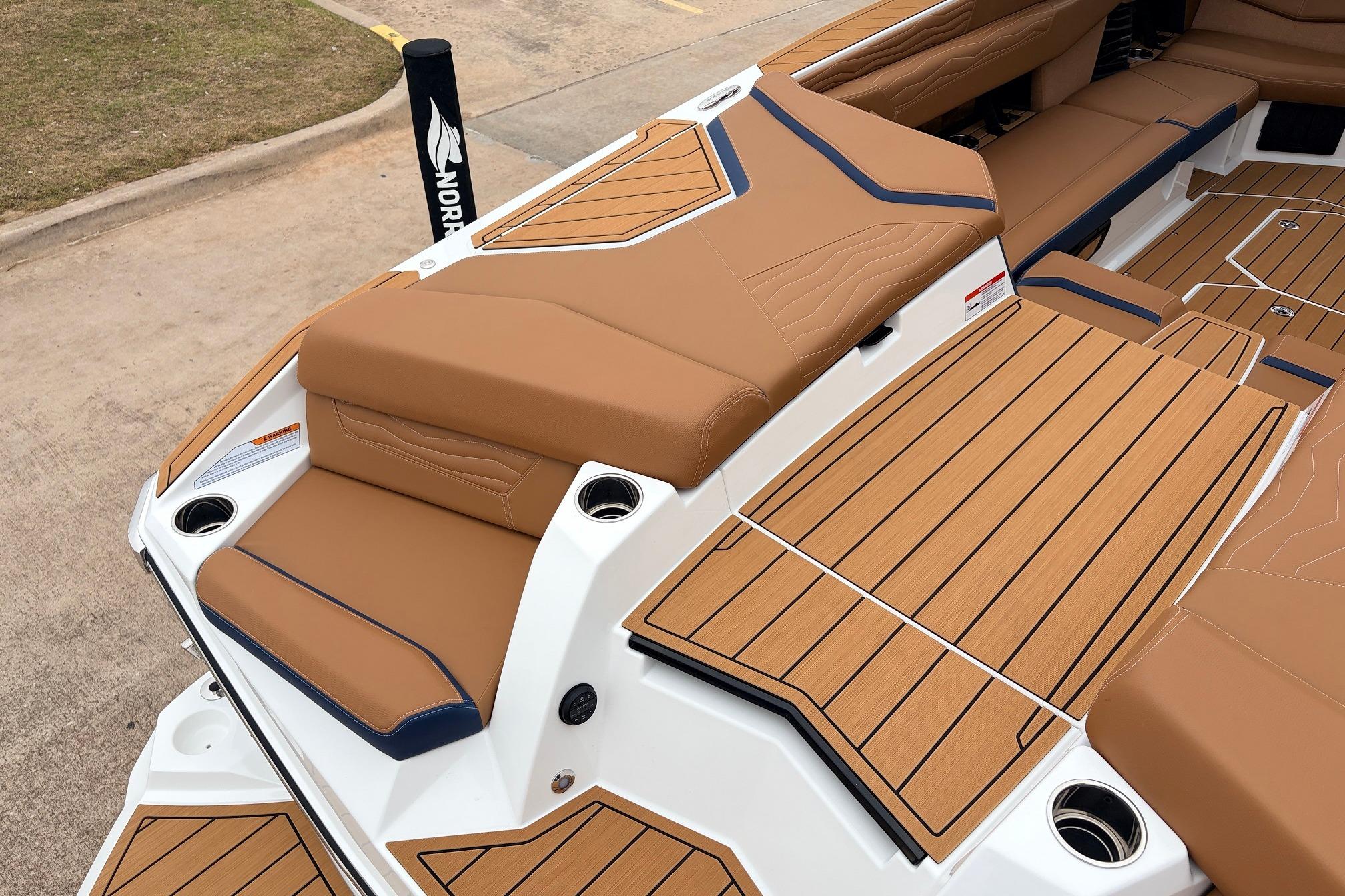 2026 Nautique Super Air Nautique G25 boat interior with tan upholstery and sleek design.