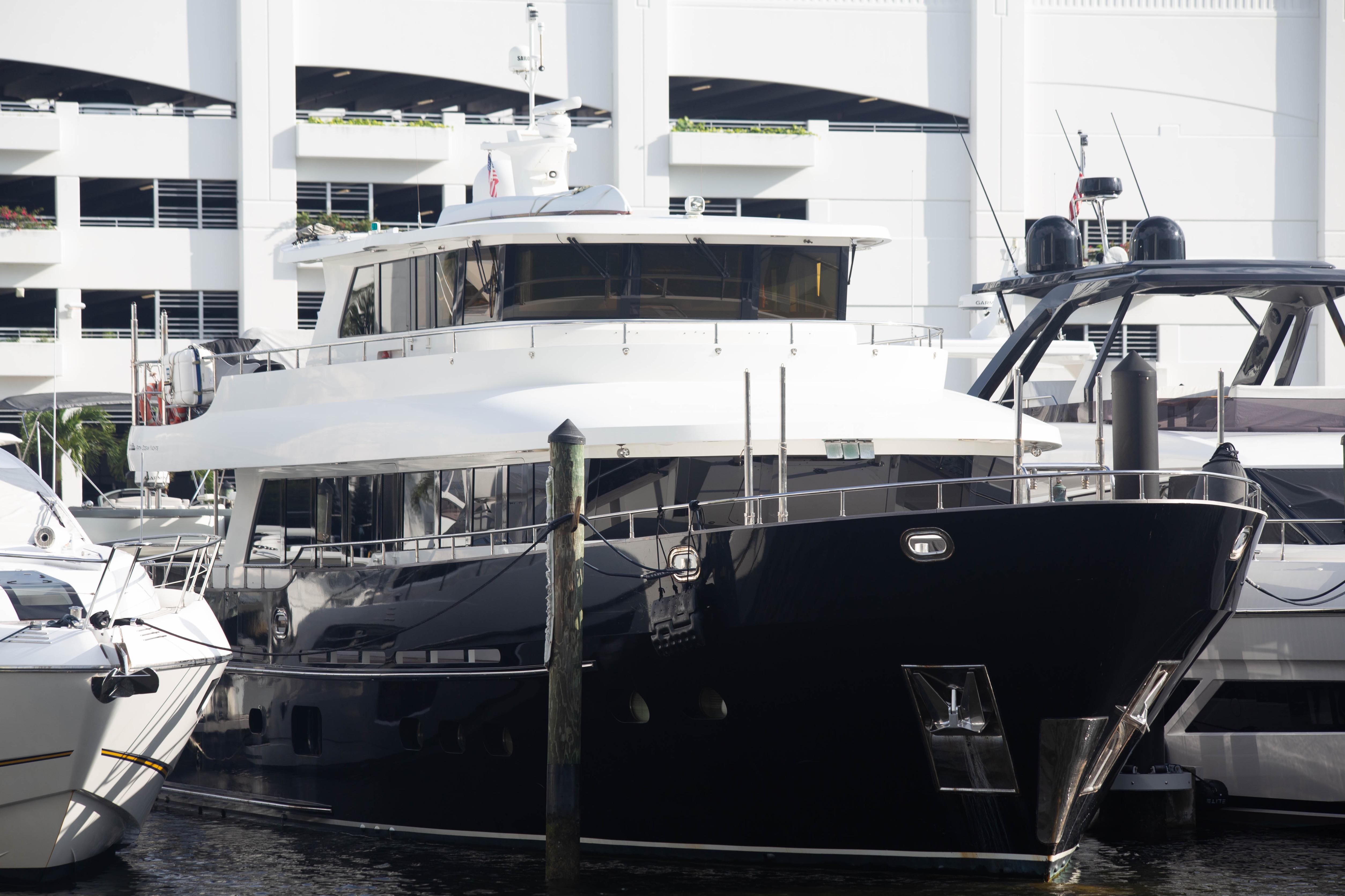 Luxurious 2014 Fifth Ocean Yachts 24m Displacement Explorer Yacht docked at marina.