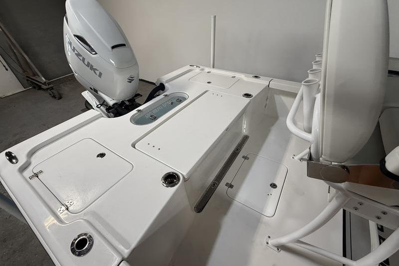 2026 Sea Pro 250 Bay boat interior with Suzuki outboard motor.