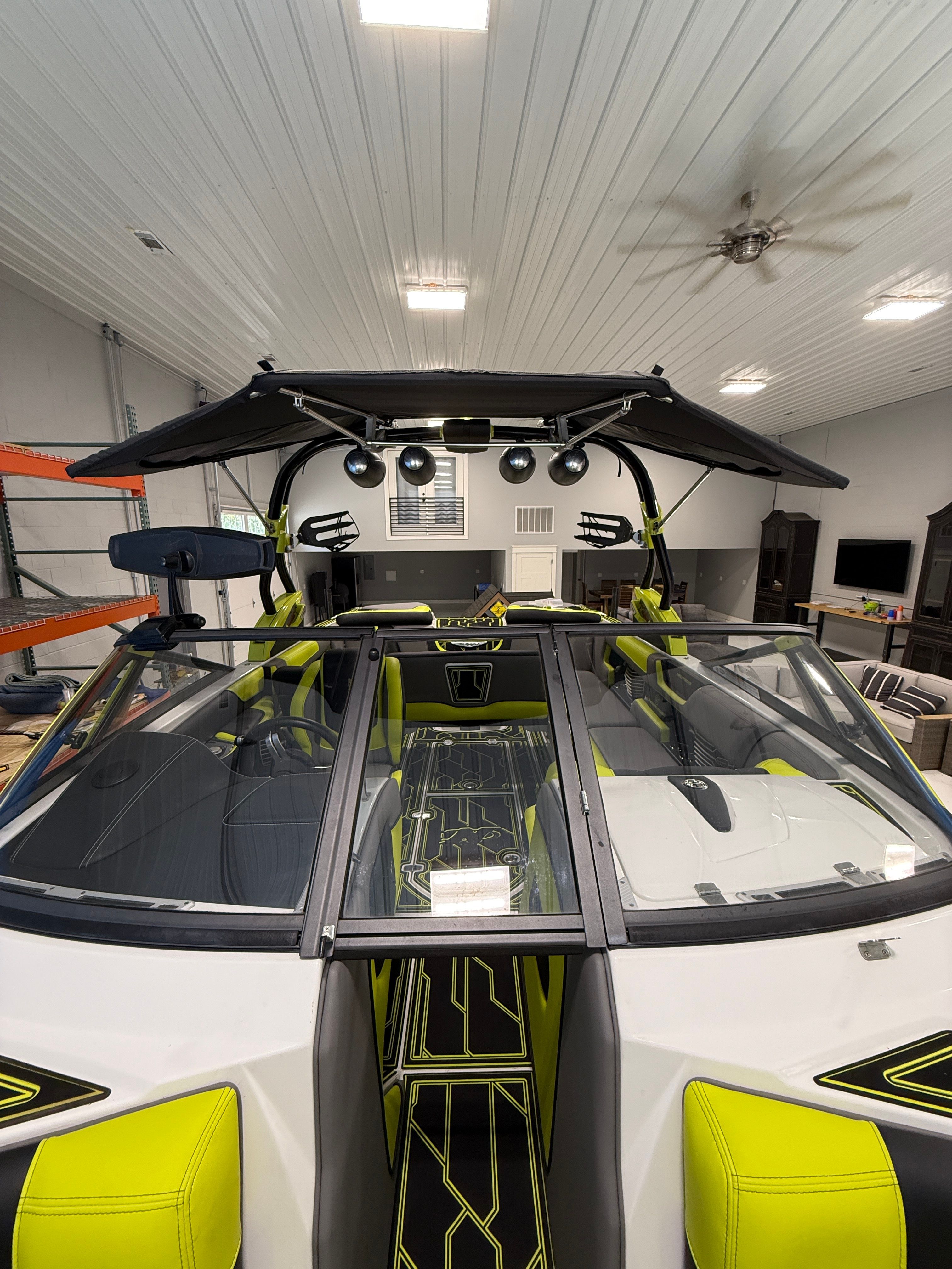 Interior view of a 2016 Nautique Super Air Nautique G23 with bright yellow accents.