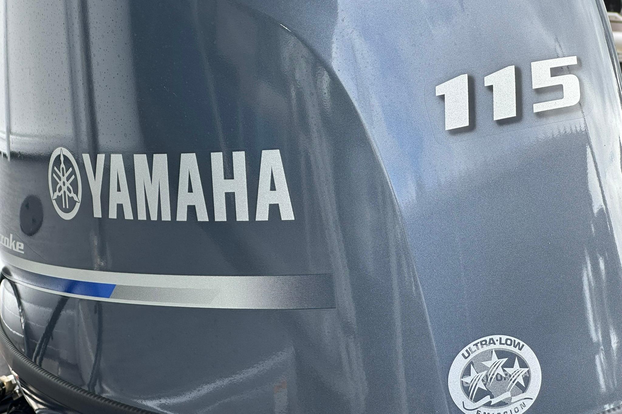 Yamaha 115 outboard motor on Sweetwater EX2086S, 2026 model, featuring ultra-low emissions.