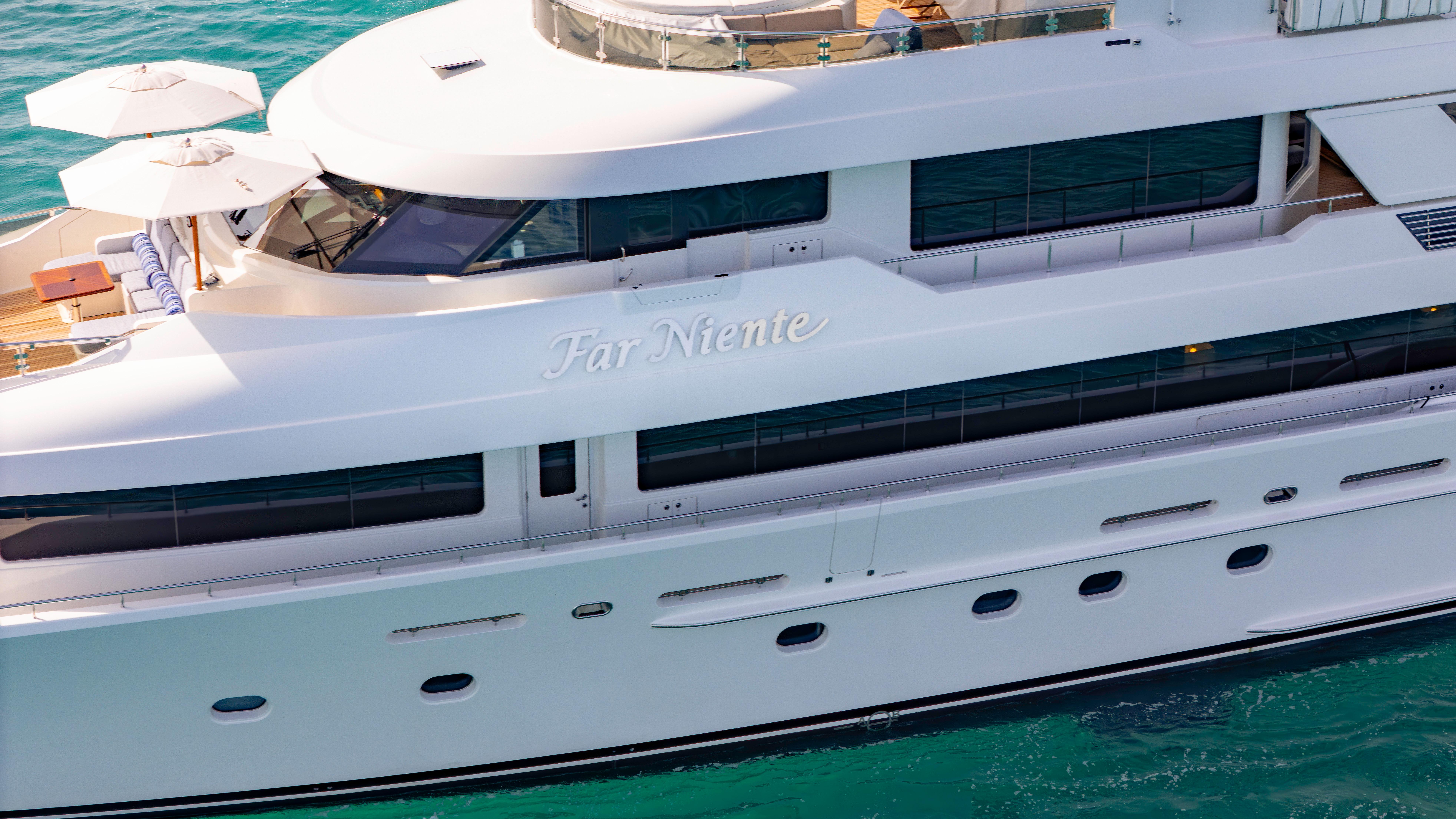 Luxurious 2014 Westport 40M yacht cruising on turquoise waters.