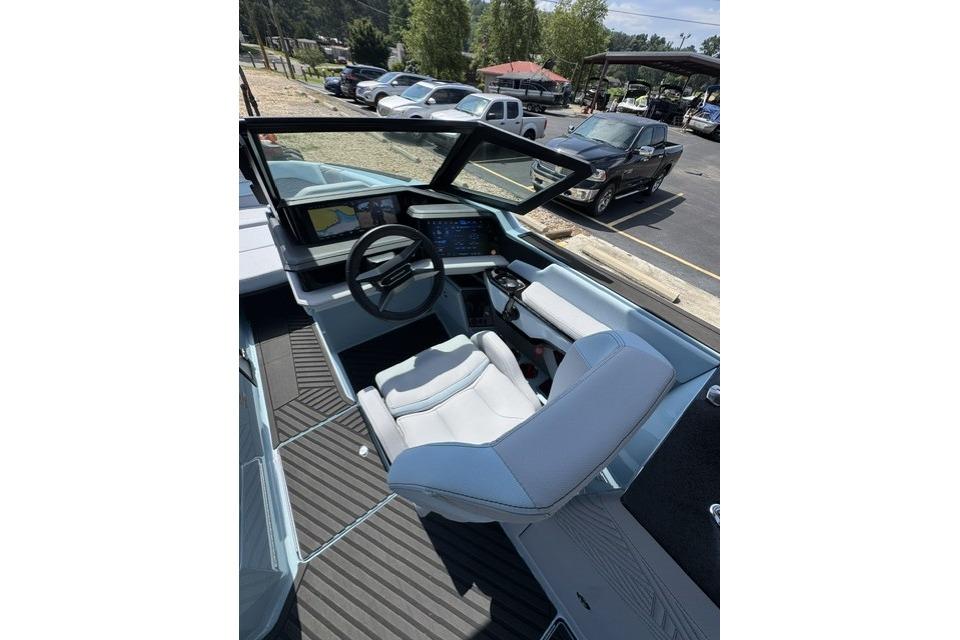 2026 MasterCraft XStar 25 boat cockpit with modern controls and comfortable seating.