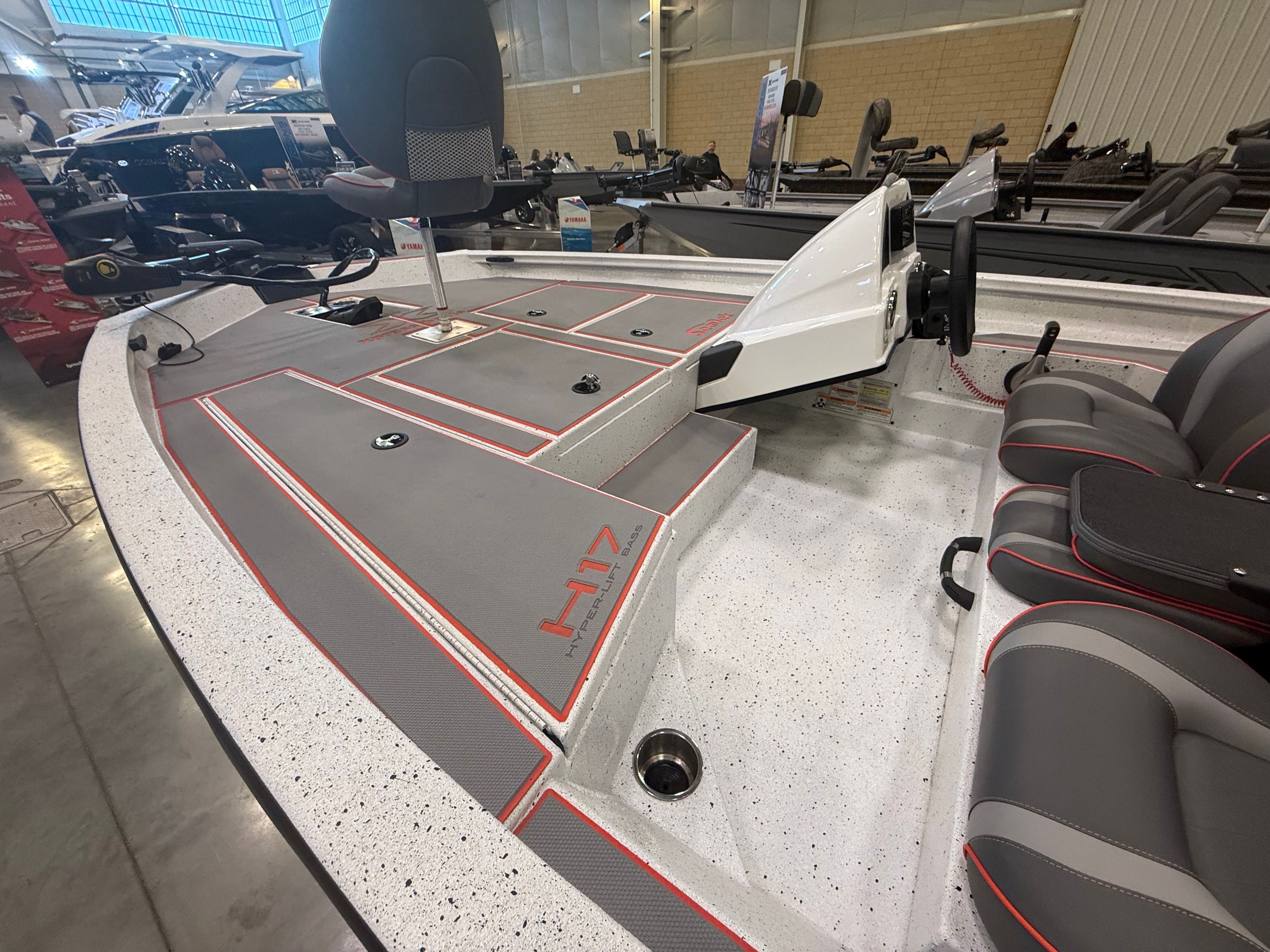 2024 Xpress H17 boat with gray interior and red accents.