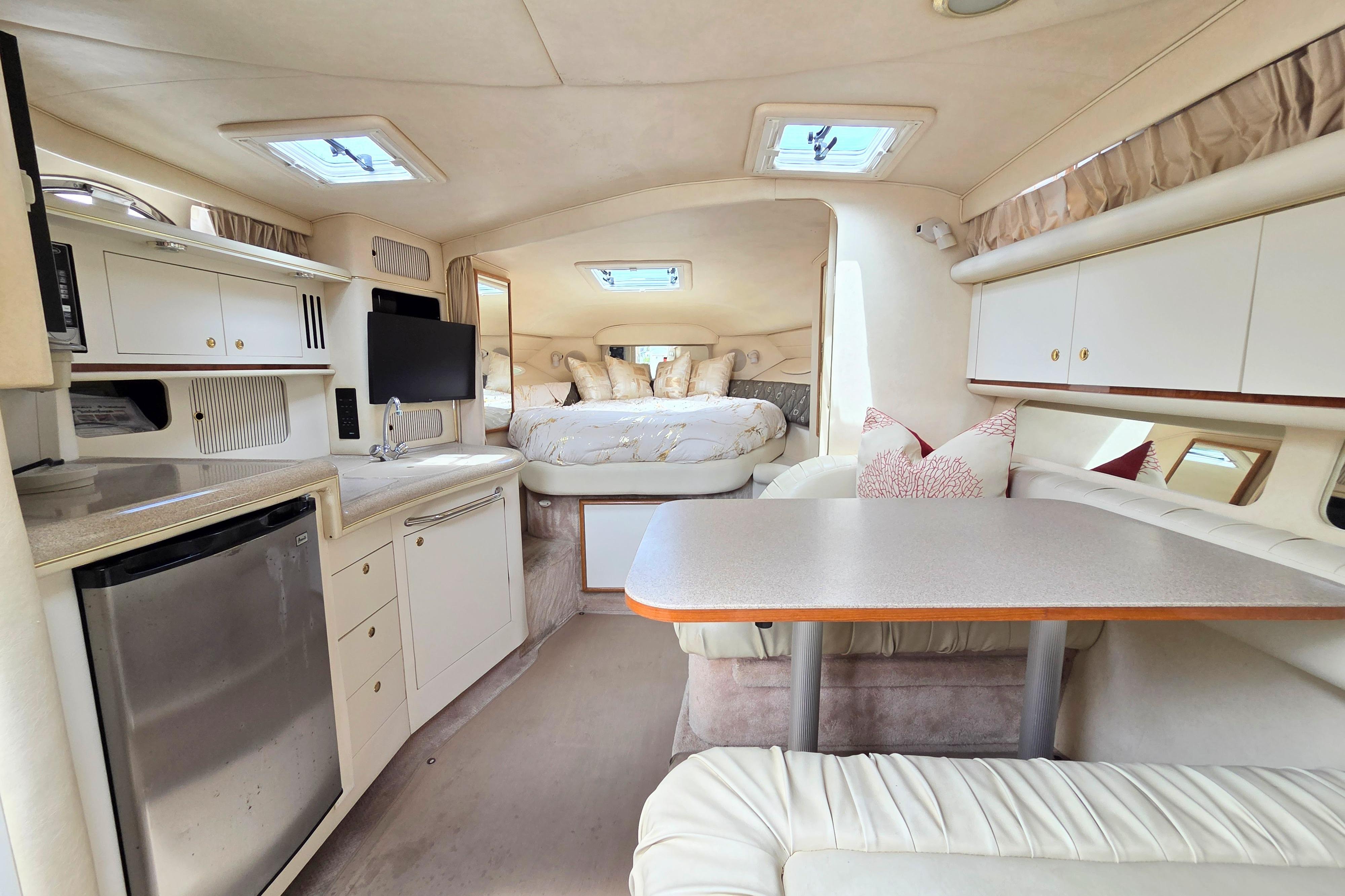 Luxurious interior of a 2000 Sea Ray 340 Sundancer yacht with modern amenities.