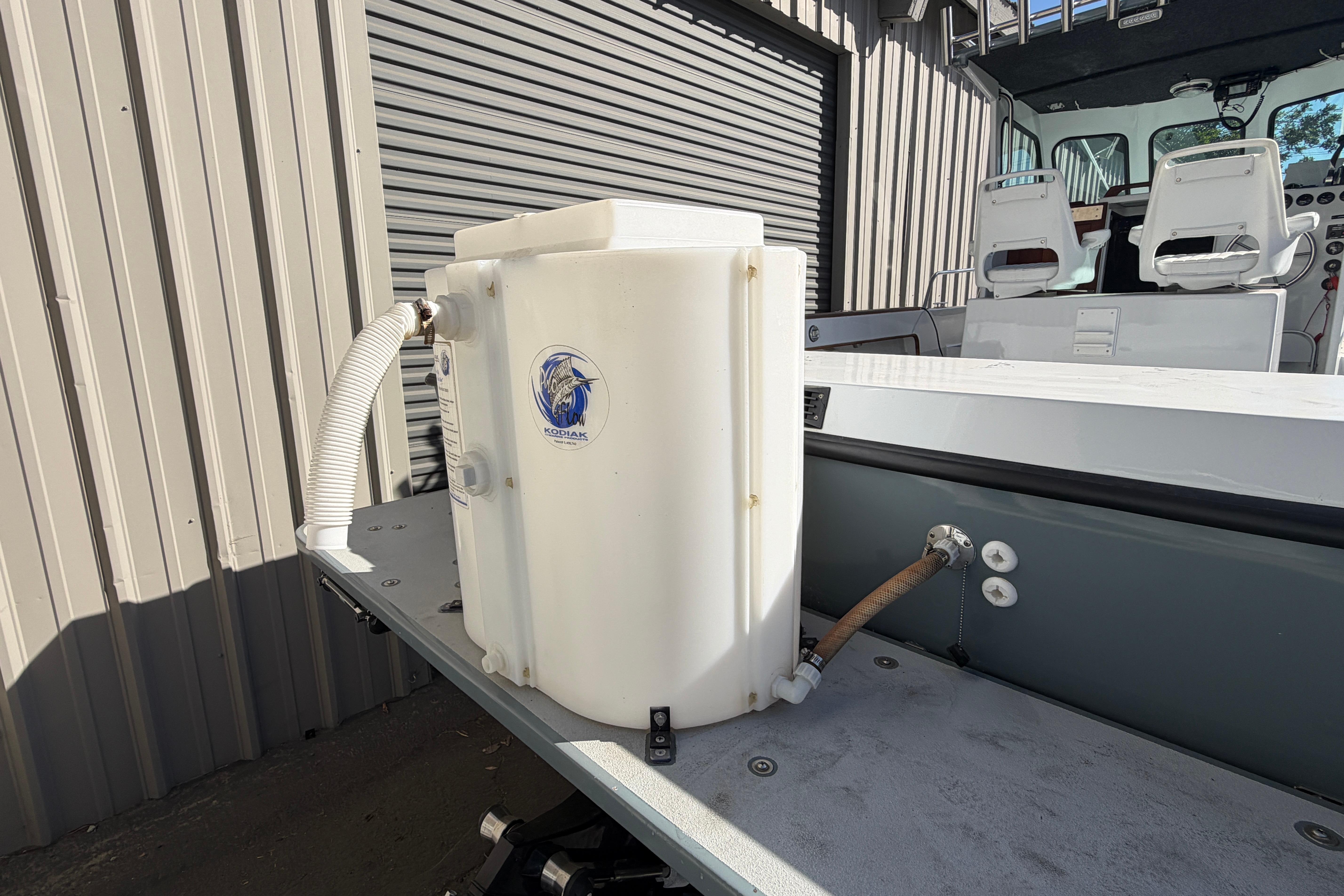 1986 Radon 21 Sport boat with a Kodiak live bait tank on deck.