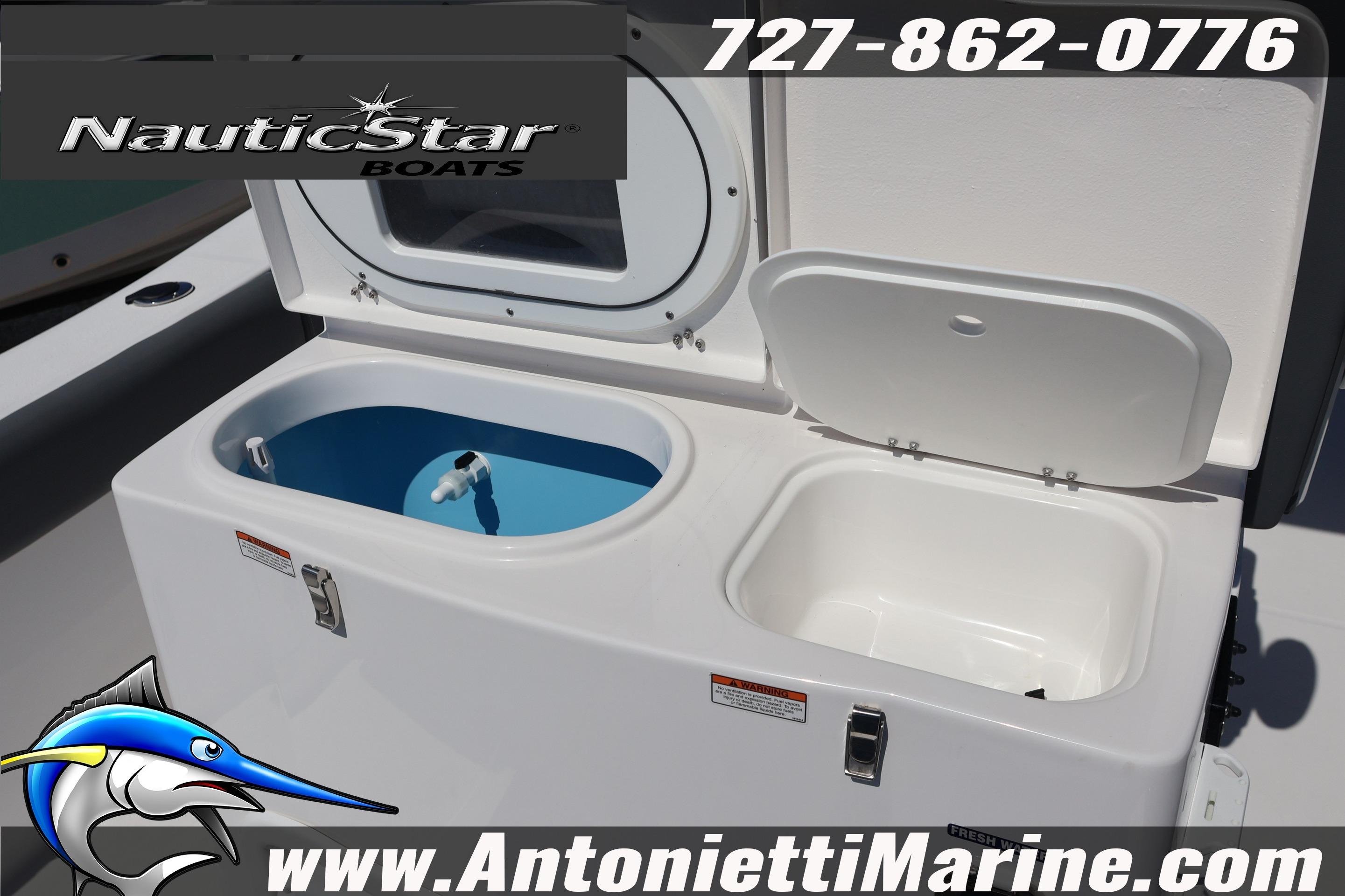 NauticStar 292 Legacy 2026 boat with open storage compartments, featuring contact details and logo.