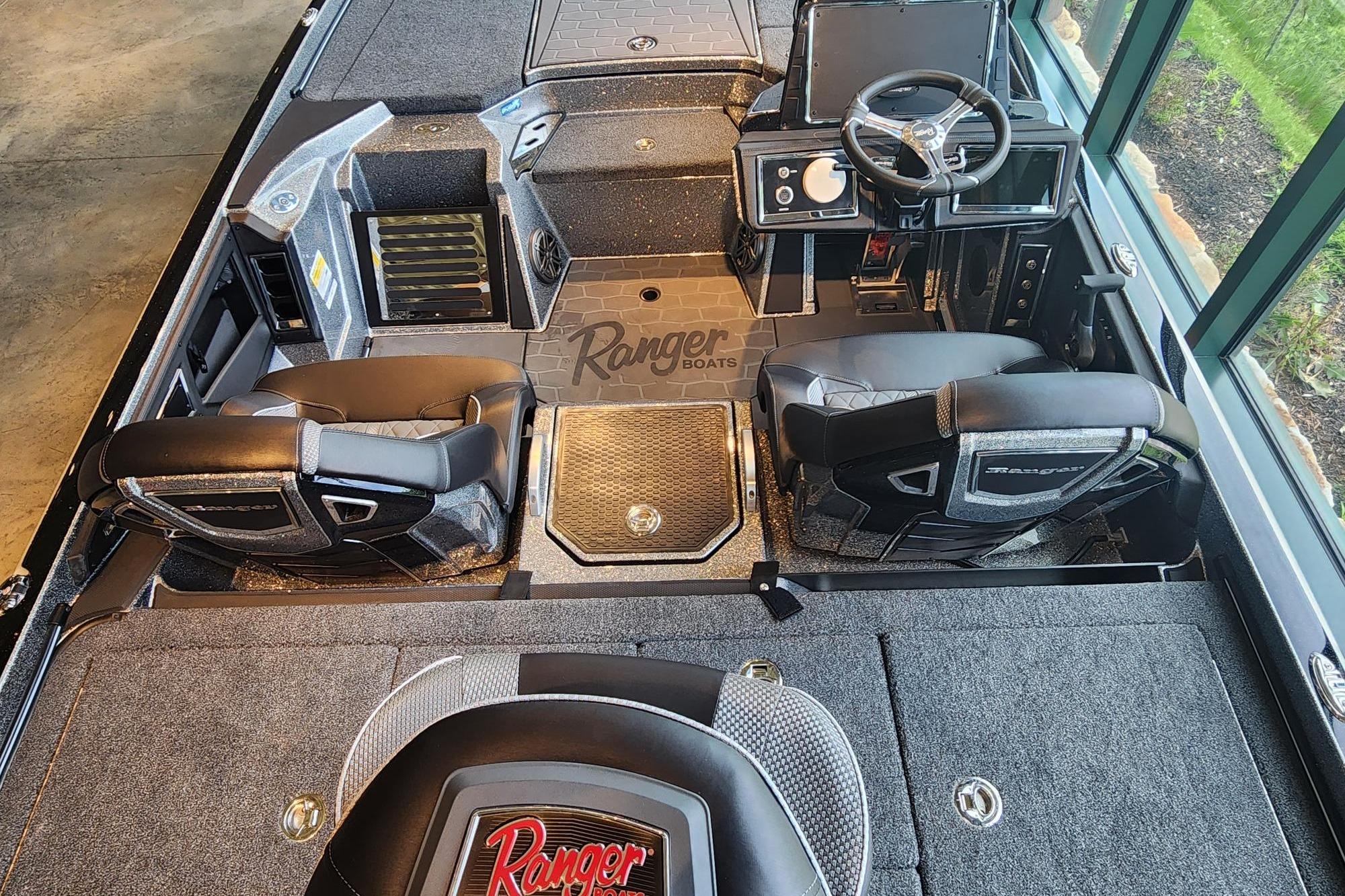 2026 Ranger Z520R boat interior with steering wheel and seating, showcasing modern design.
