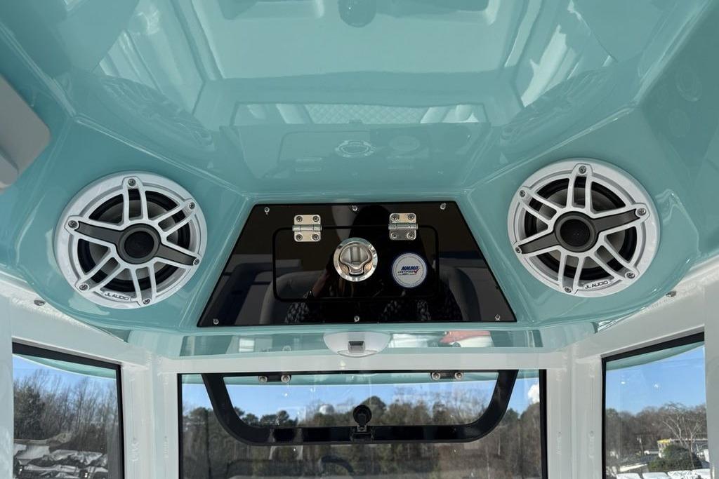 2026 Sportsman Masters 247OE Bay Boat interior with JL Audio speakers and control panel.