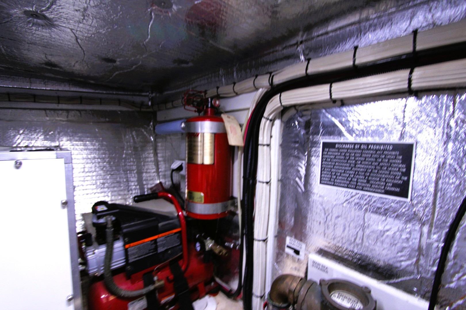 Engine room of a 2002 Nordic Tug 37 with insulated walls and machinery.
