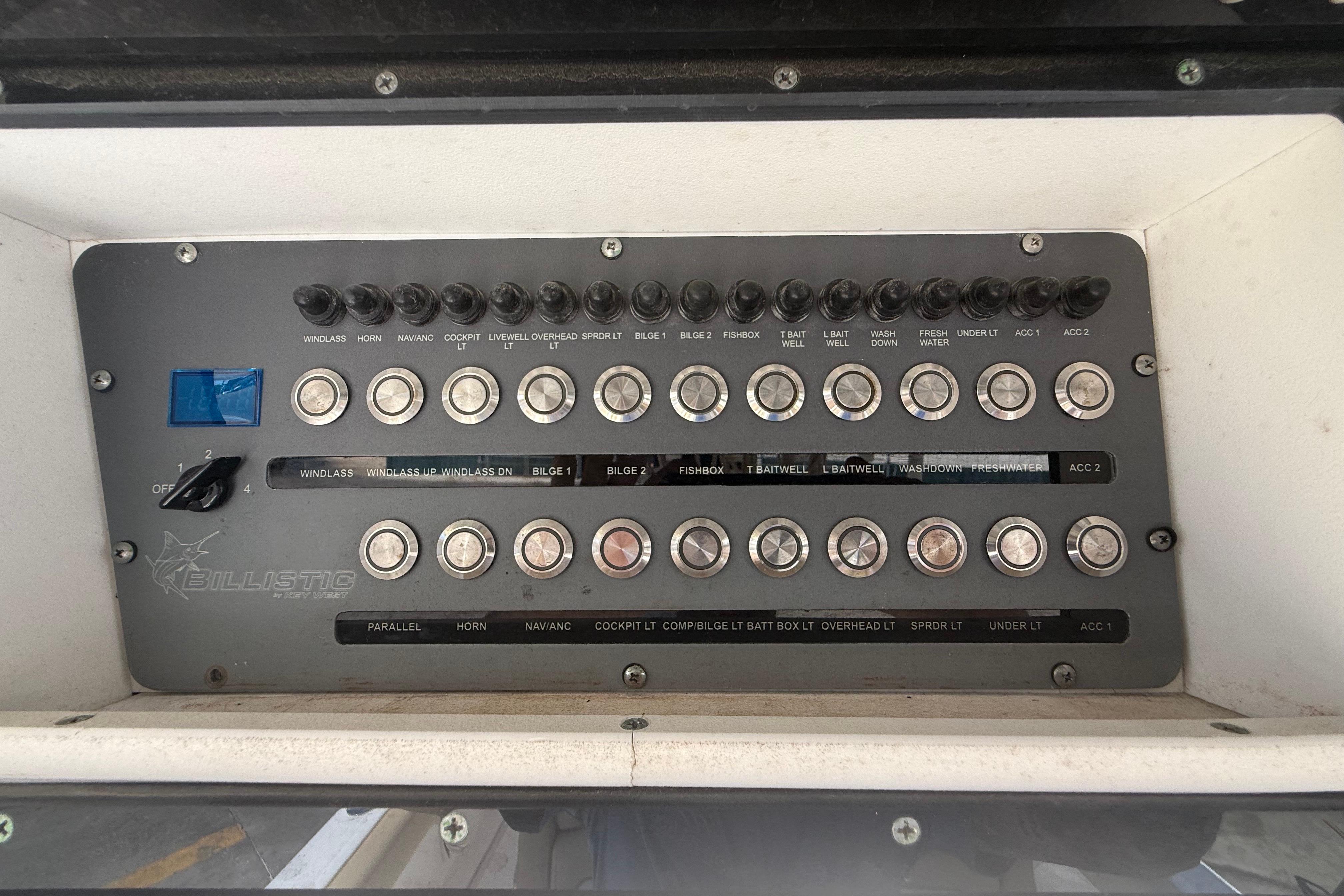 Control panel of a 2019 Key West Billistic 281 Center Console boat with labeled switches.