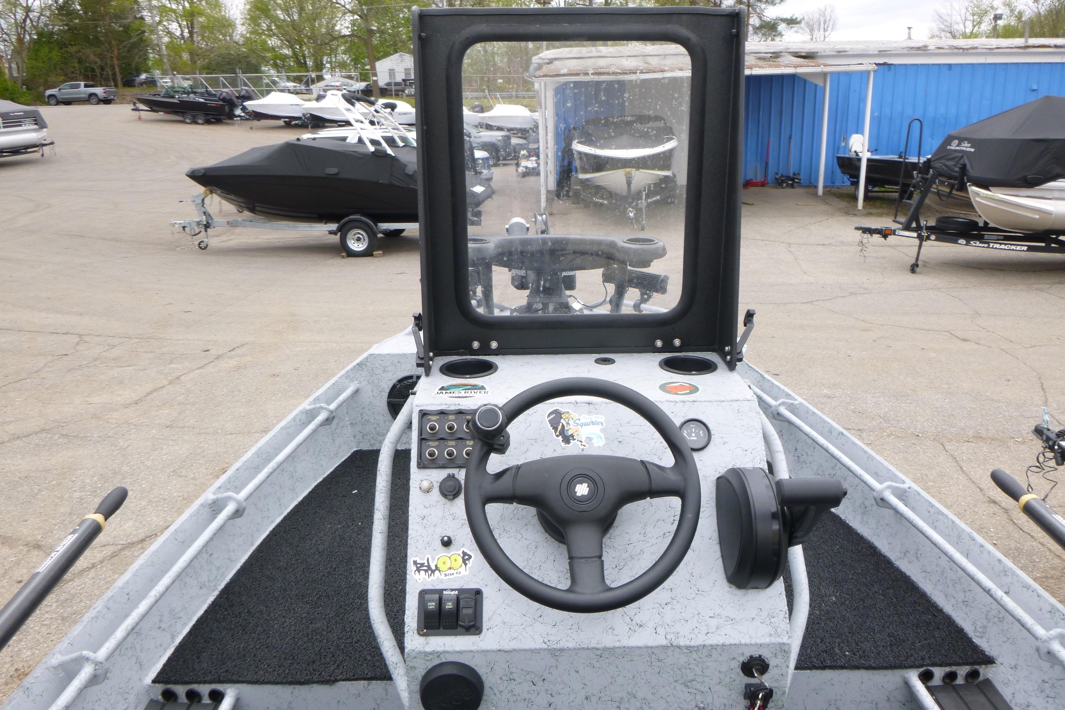 StealthCraft 16 StealthWeld 2025 boat dashboard with steering wheel and controls.
