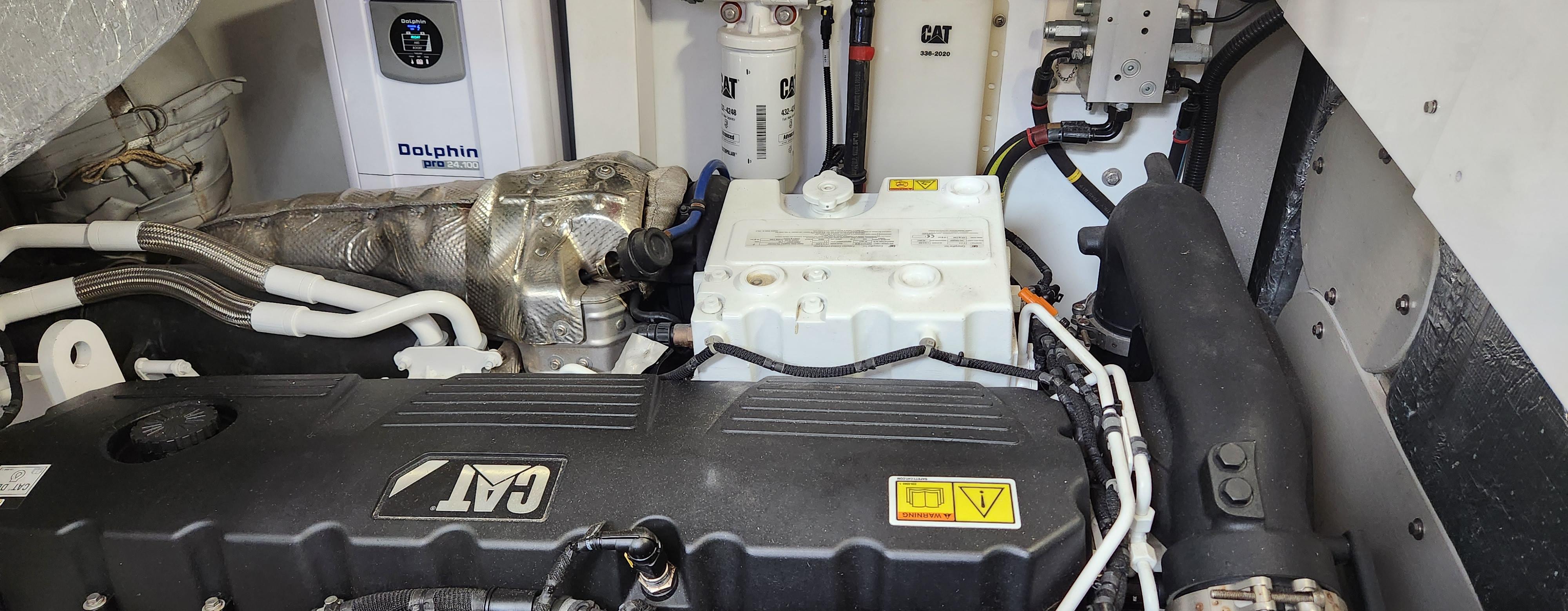 Engine compartment of a 2018 Sunseeker Predator yacht with CAT engine and Dolphin battery charger.