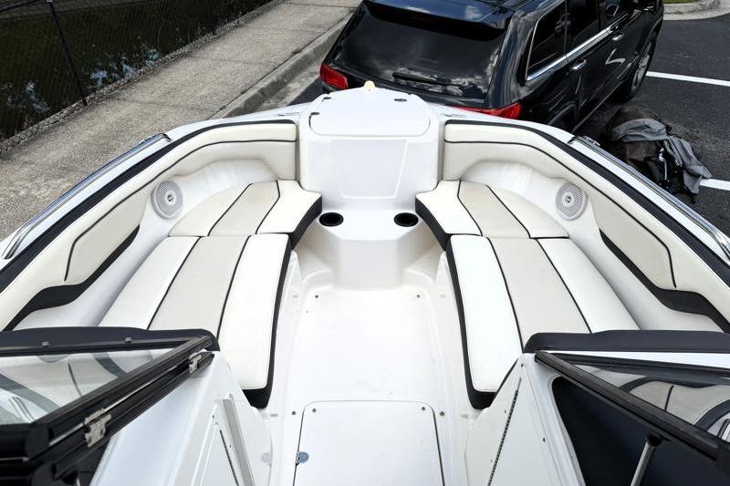 2017 Yamaha Boats SX210 interior with white seating and cup holders.