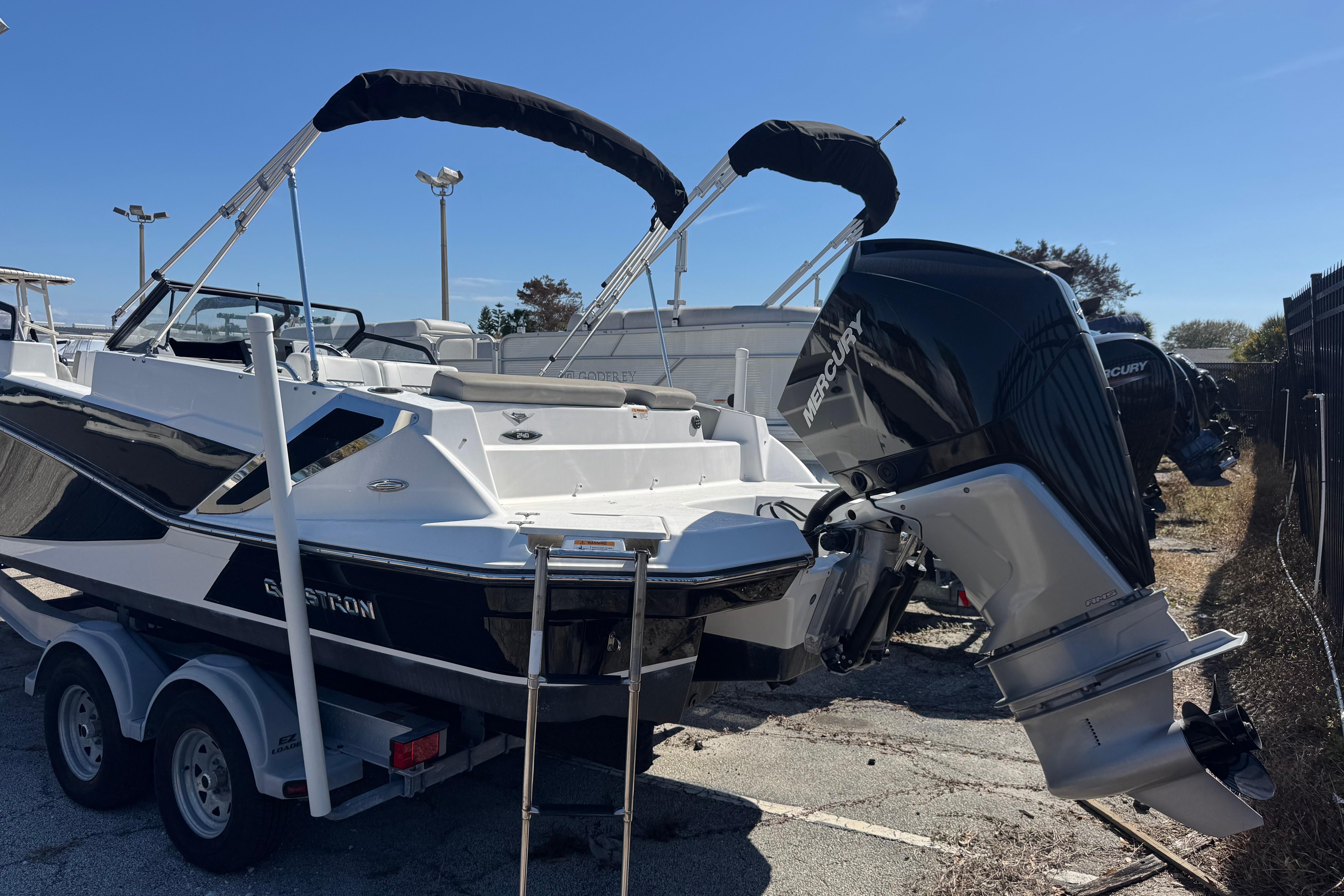2020 Glastron GTD 240 boat with Mercury outboard engine on trailer.