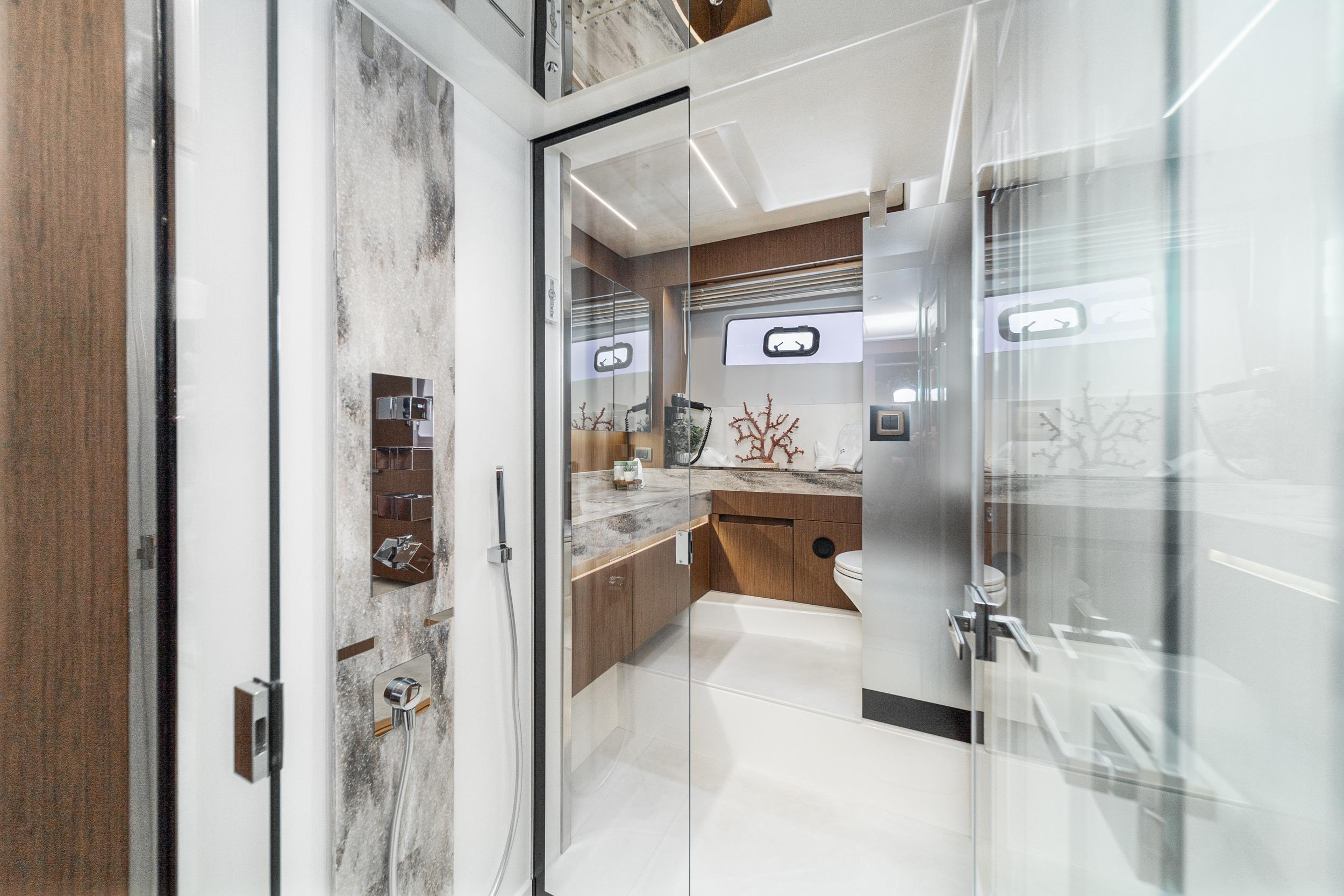 Luxurious bathroom interior of 2024 Prestige X60 yacht with modern fixtures and elegant design.
