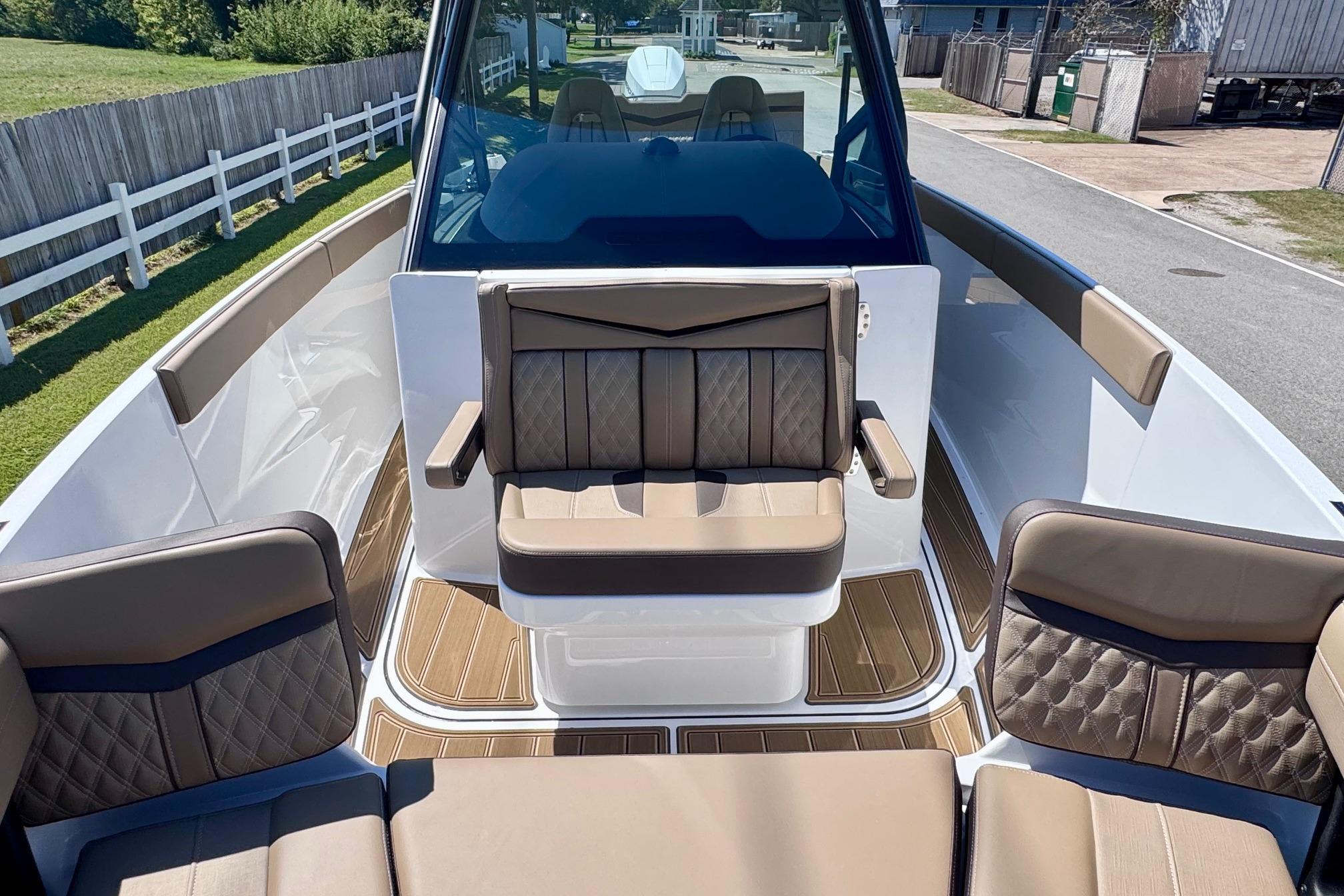 2026 Monterey Elite 27 OB boat interior with luxurious seating and modern design.