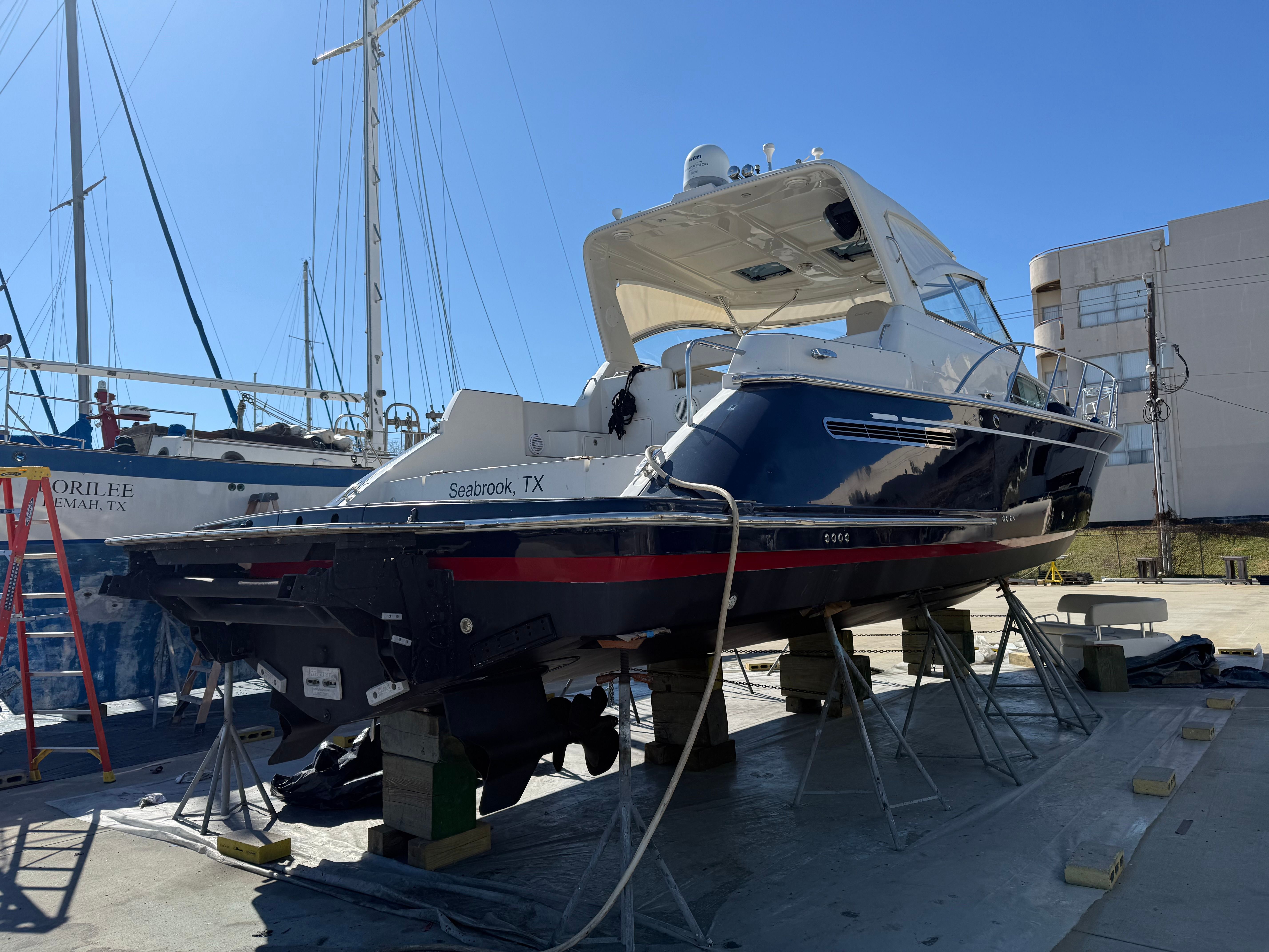 A 2007 Chris-Craft Roamer 40 is on a dry dock for maintenance.