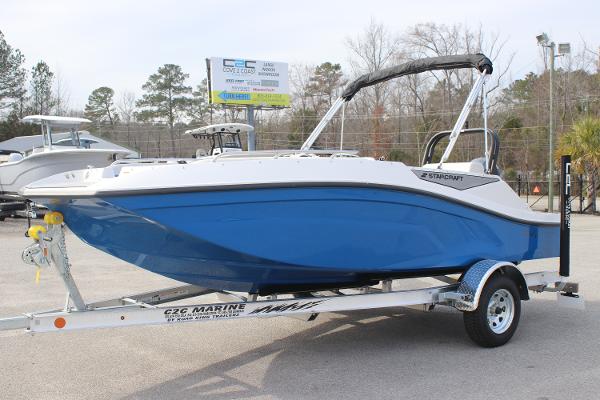 2025 Starcraft SV 16 OB boat in blue on a trailer, parked outdoors.