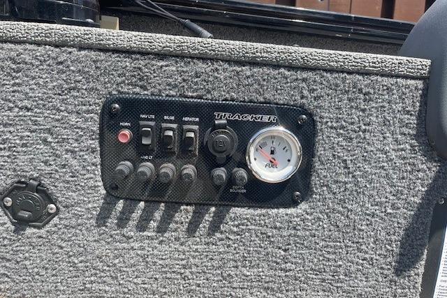 Control panel of a 2019 Tracker Panfish 16 boat with fuel gauge and switches.