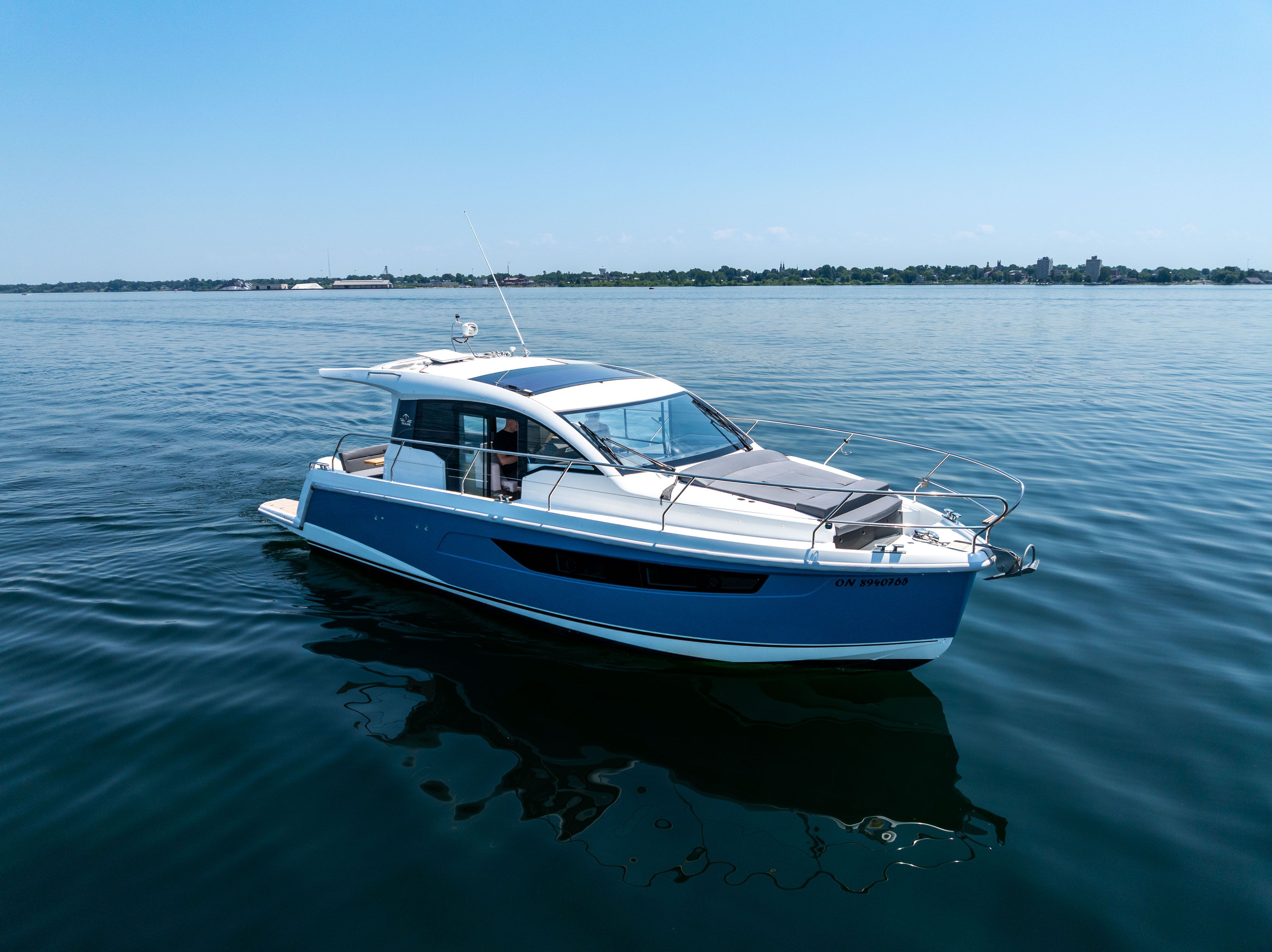Sealine C335V 2023 on calm water.