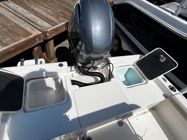 2024 Key West 188 Bay Reef boat stern with motor and storage compartments.
