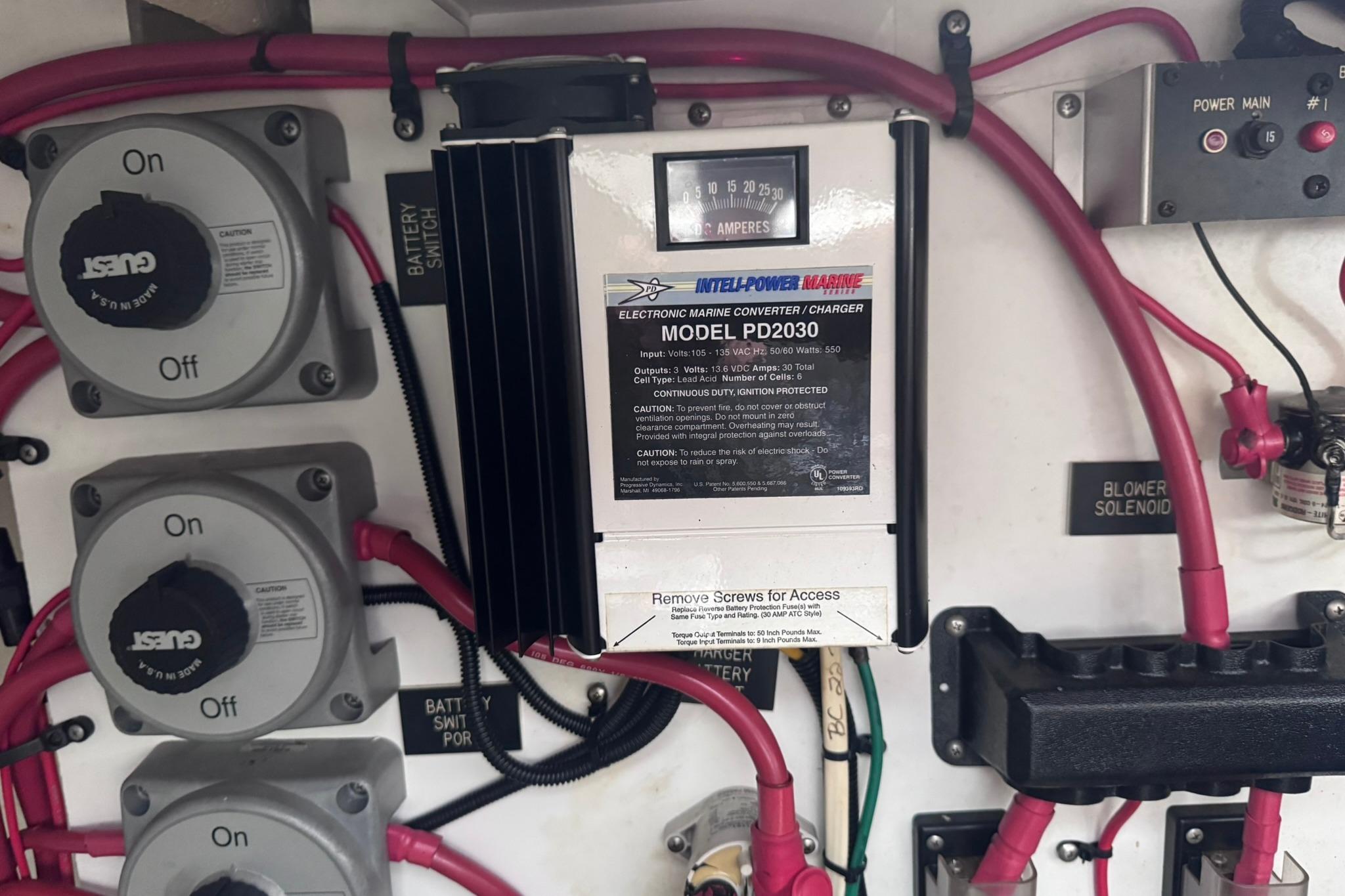Electrical panel of 2002 Cruisers Yachts 3275 Express with marine converter and battery switches.