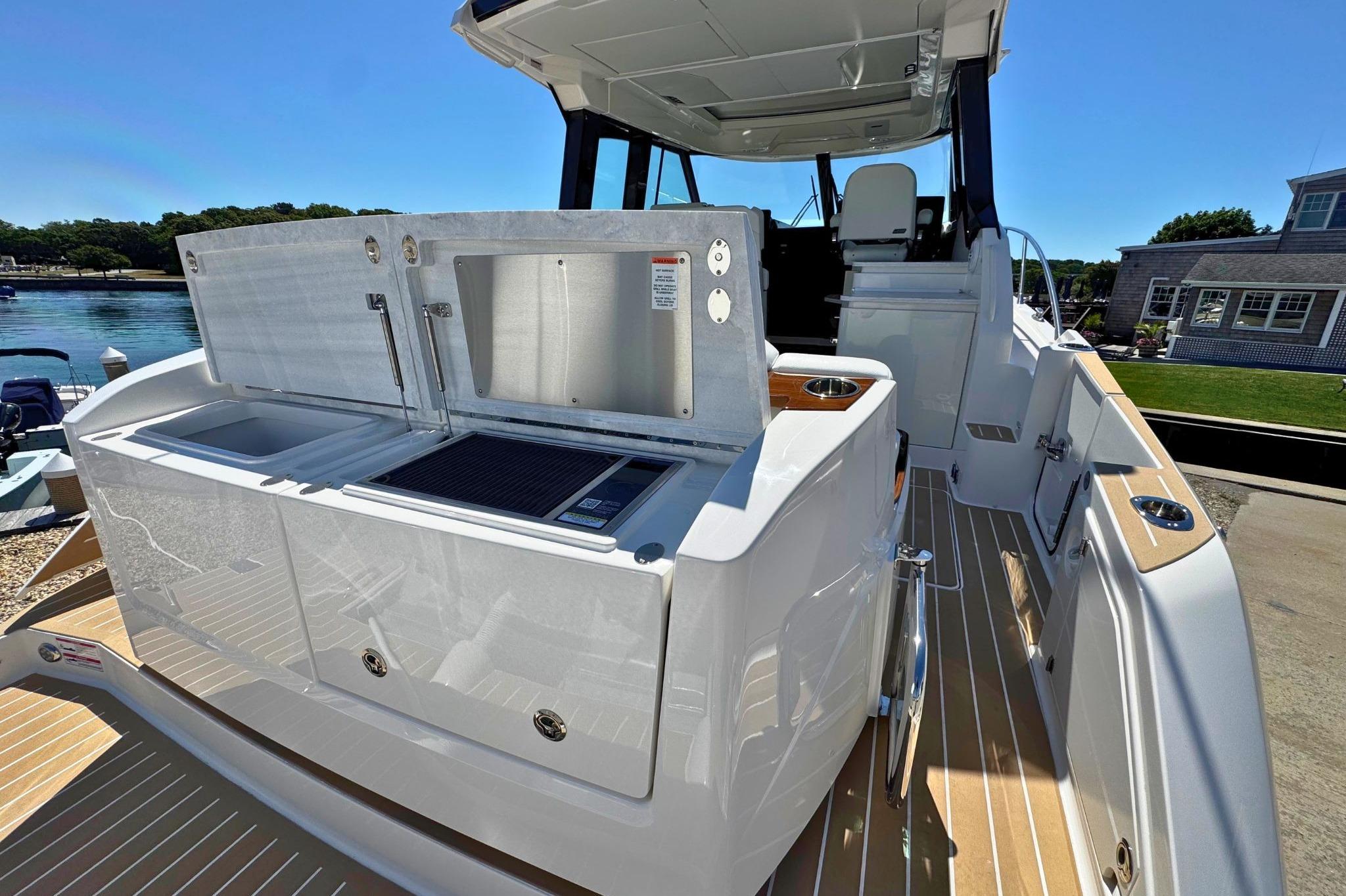 2027 Tiara Yachts 39 LE luxury yacht deck with outdoor kitchen and seating area.