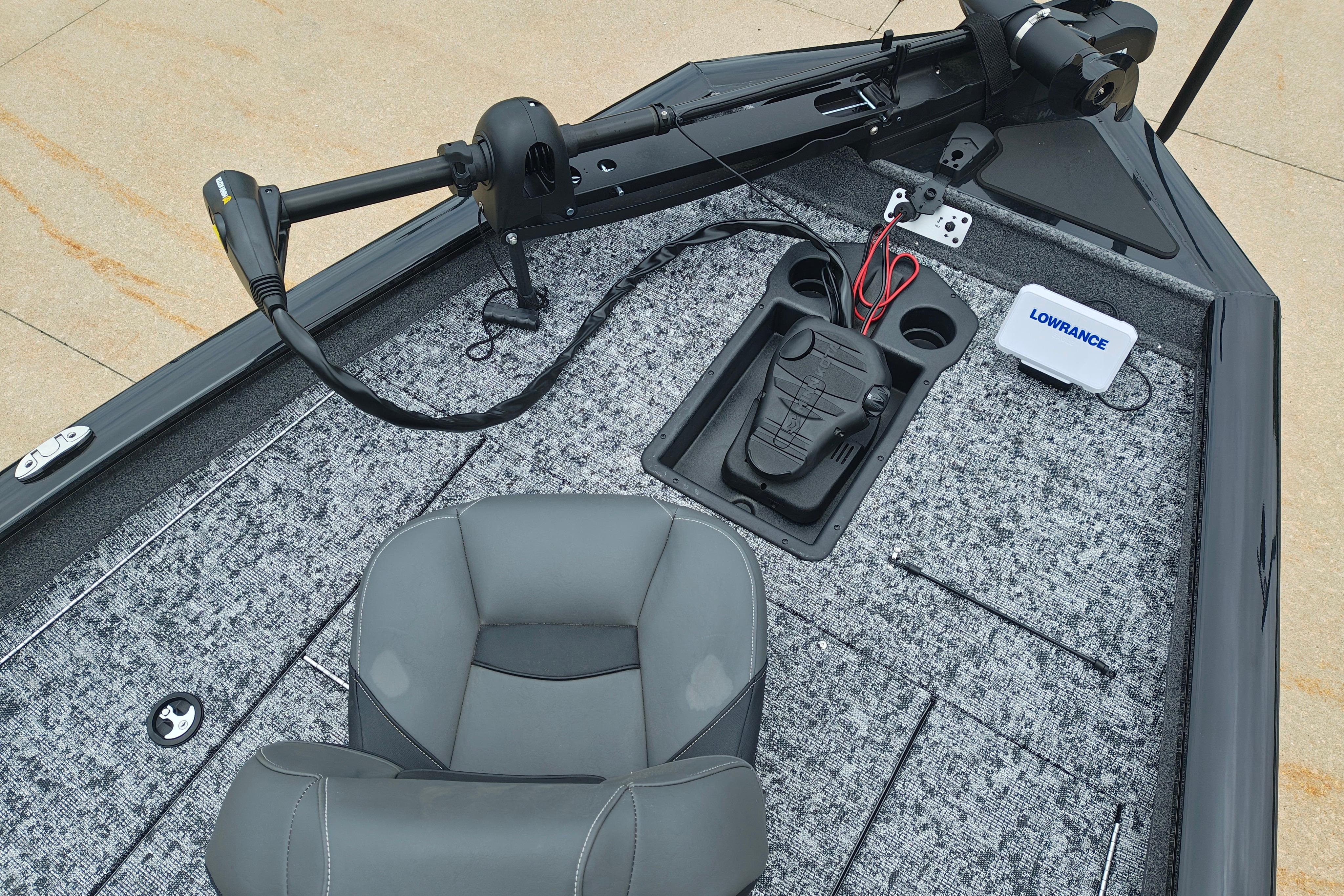 Interior of 2026 Tracker Pro Team 175 boat with fishing seat and control panel.