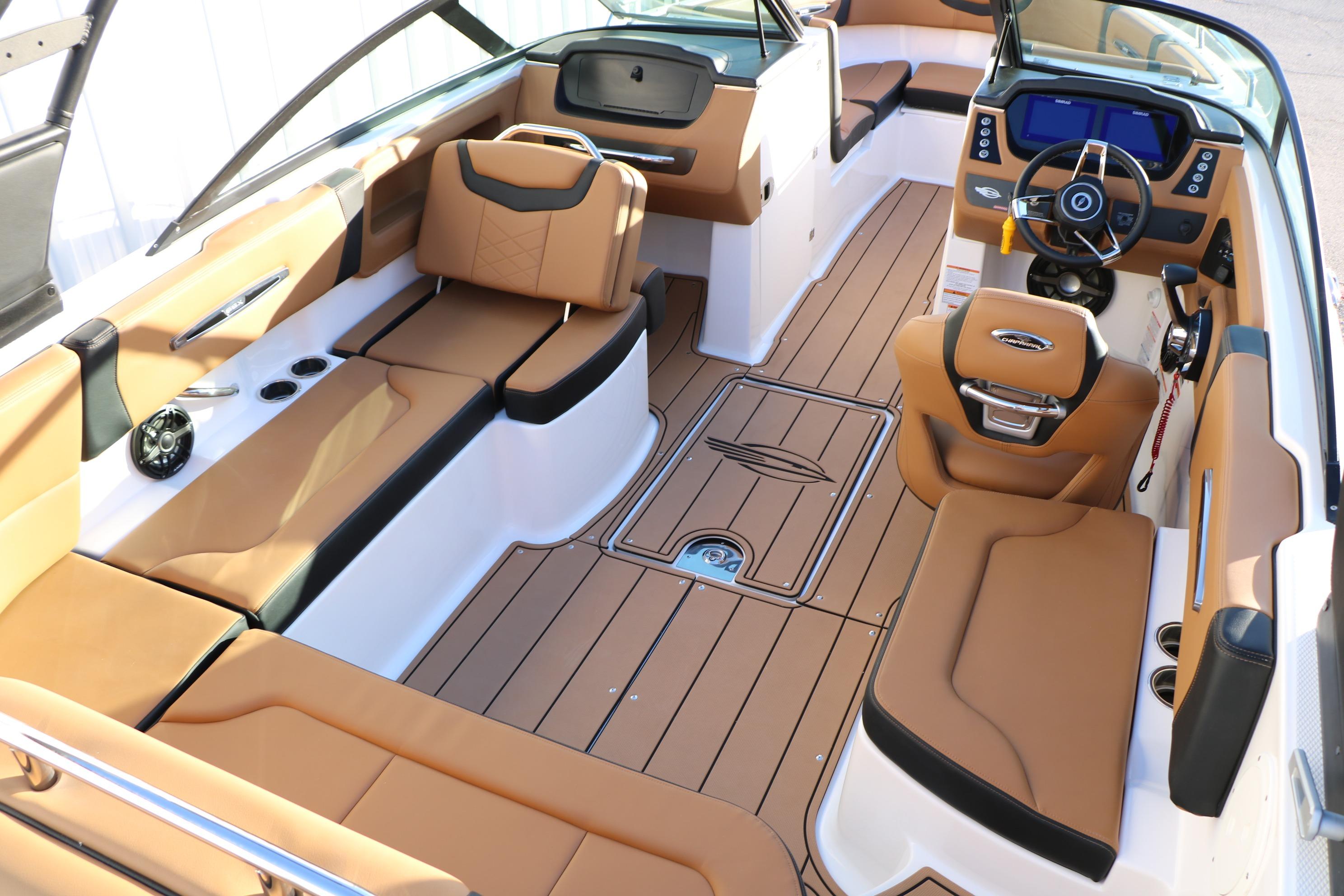2026 Chaparral 247 SSX boat interior with tan leather seats and modern dashboard.