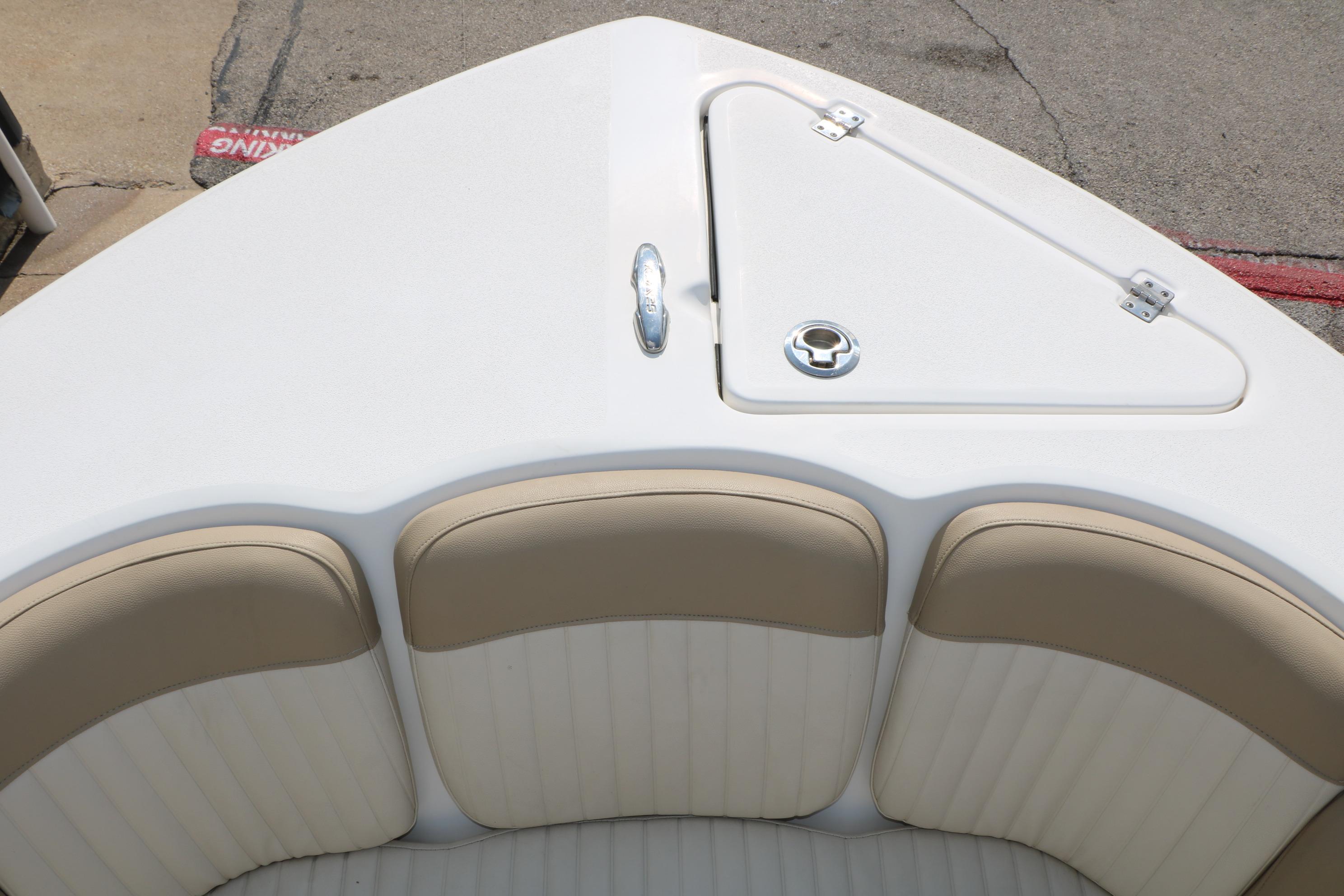 Bow seating area of a 2017 Sea Fox 226 Traveler boat with storage compartment.