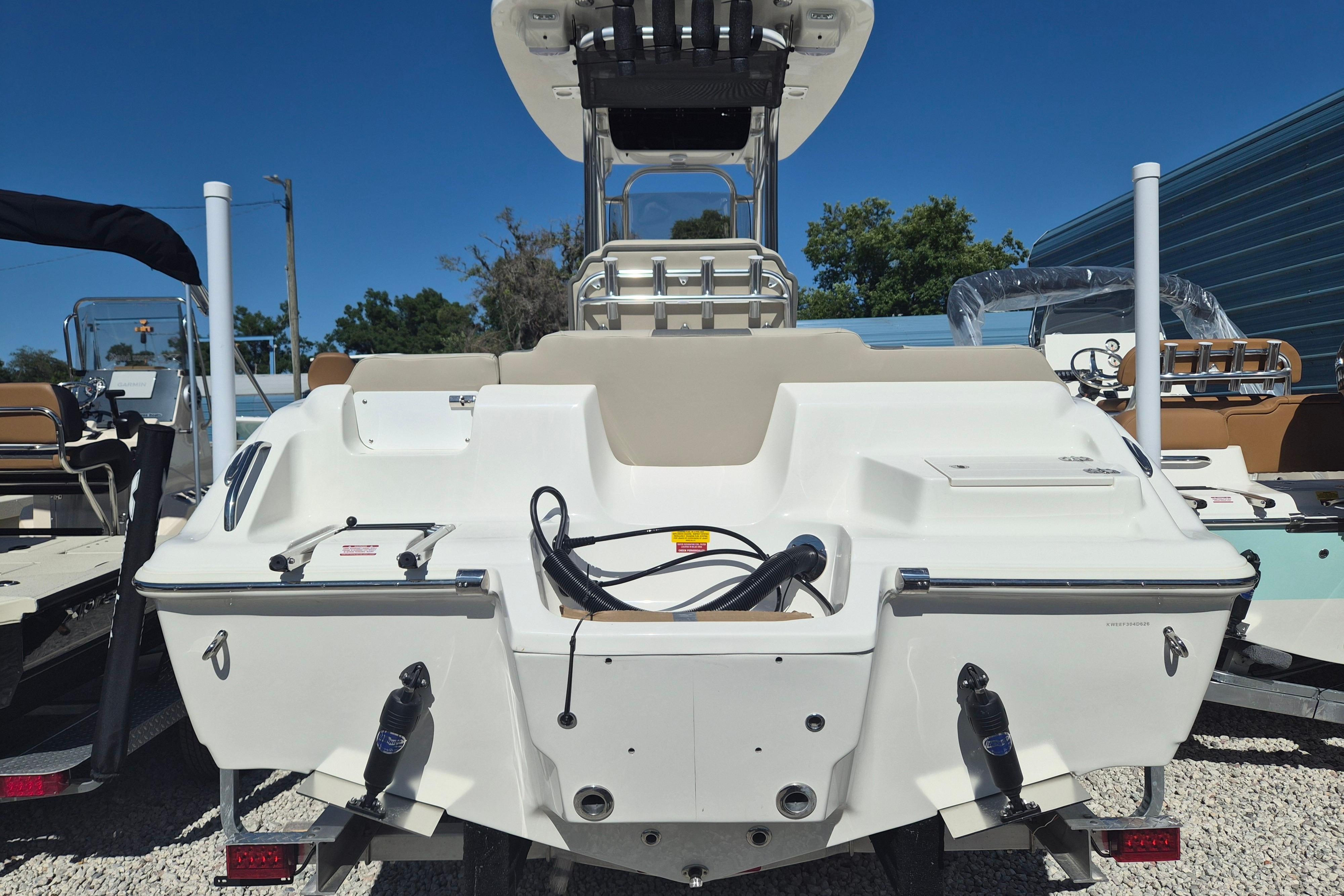 2026 Key West 239 FS boat rear view, showcasing seating and storage features.