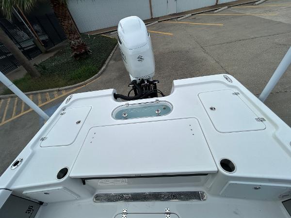 2024 Sea Pro 250 DLX boat deck with outboard motor, viewed from above.