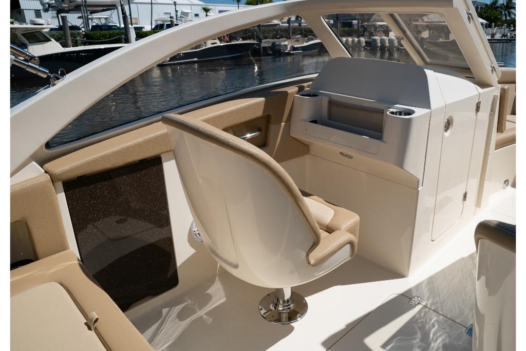2023 Scout 240 Dorado boat interior with helm seat and console.