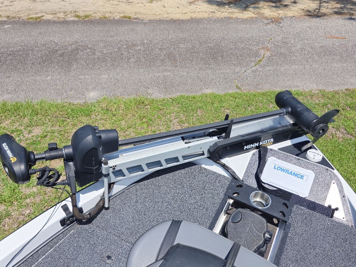 A Minn Kota trolling motor is mounted on a Caymas CX 18 SS boat.