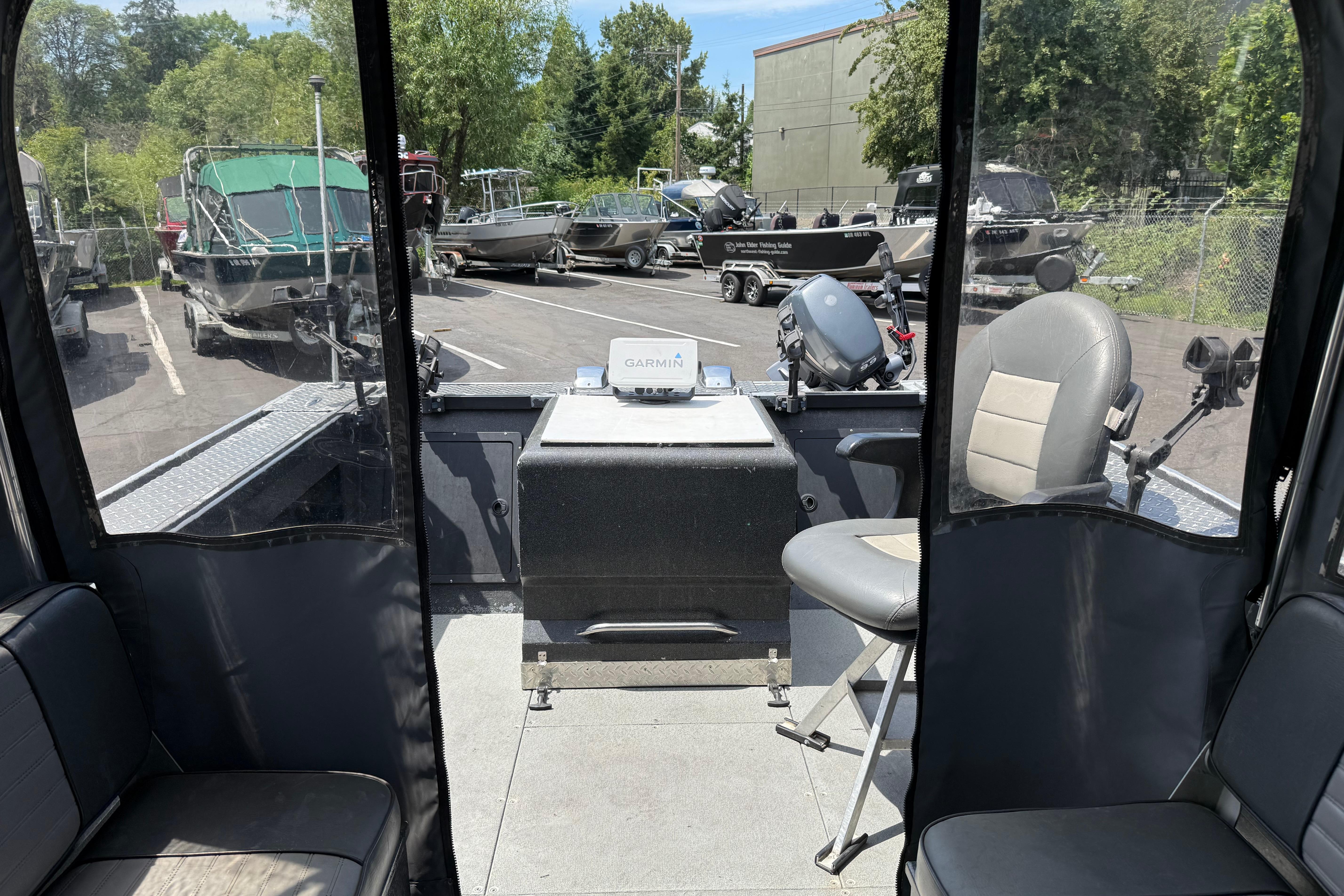 Interior view of a 2005 Willie Raptor 21' boat with seating and navigation equipment.