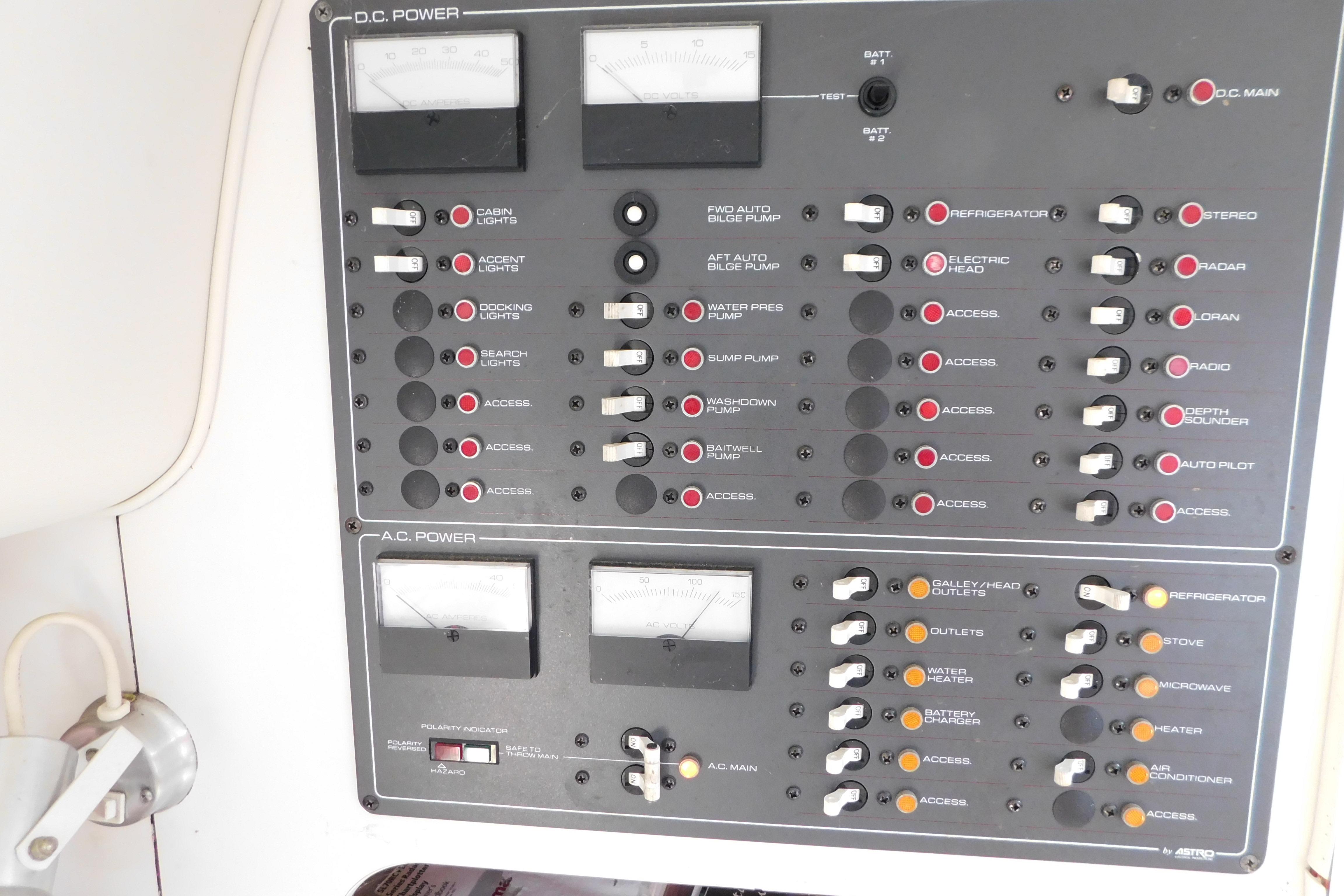 Control panel of a 1993 Tiara Yachts 3100 Open, featuring DC and AC power switches.