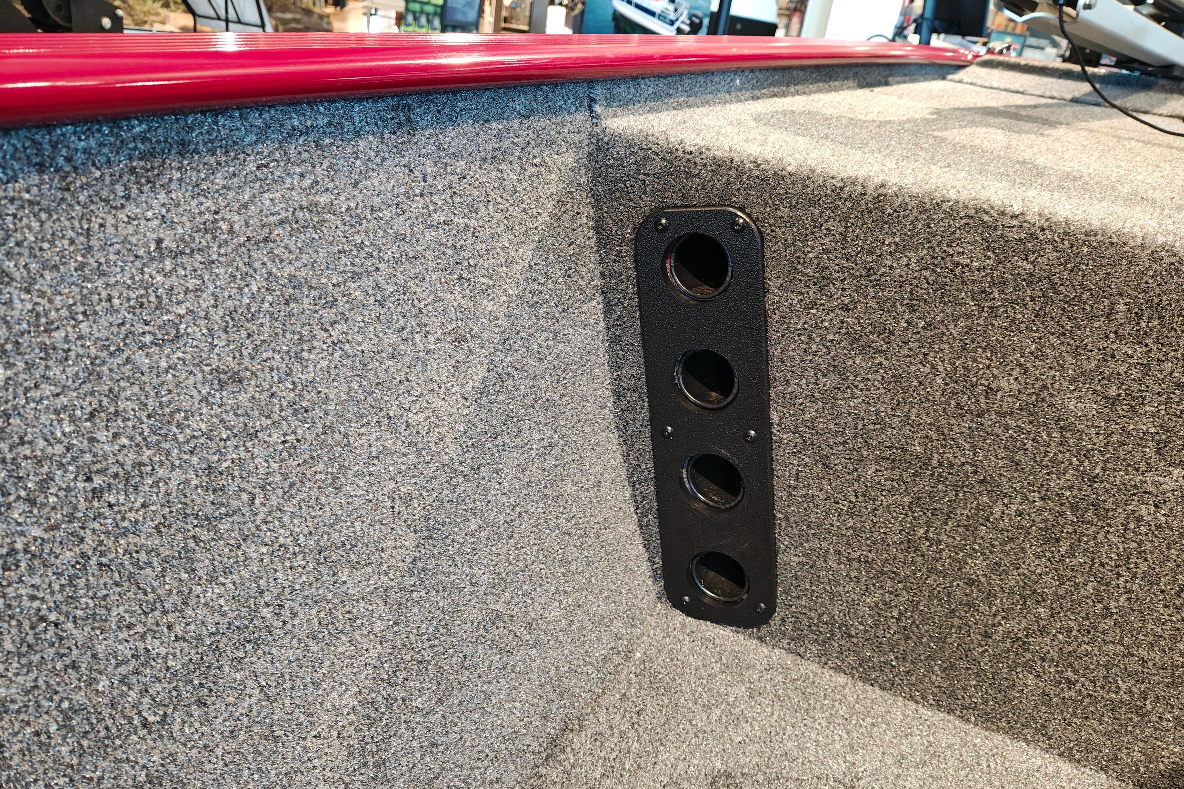 Interior of 2026 Tracker Bass Tracker Classic XL boat with carpeted finish and rod holder.