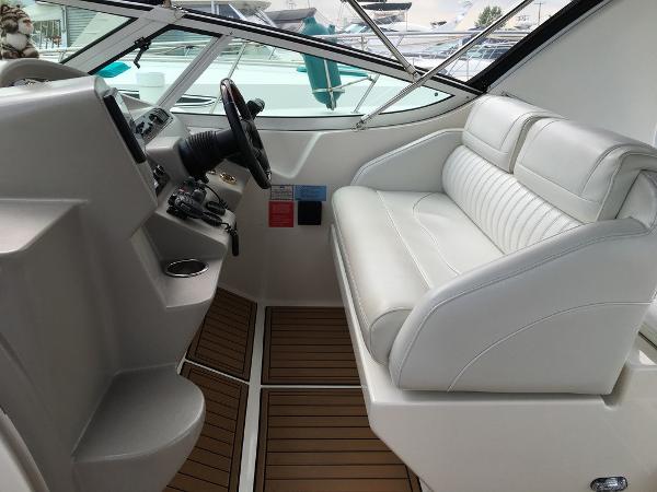 Interior of a 2004 Cruisers Yachts 3372 Express with white seating.