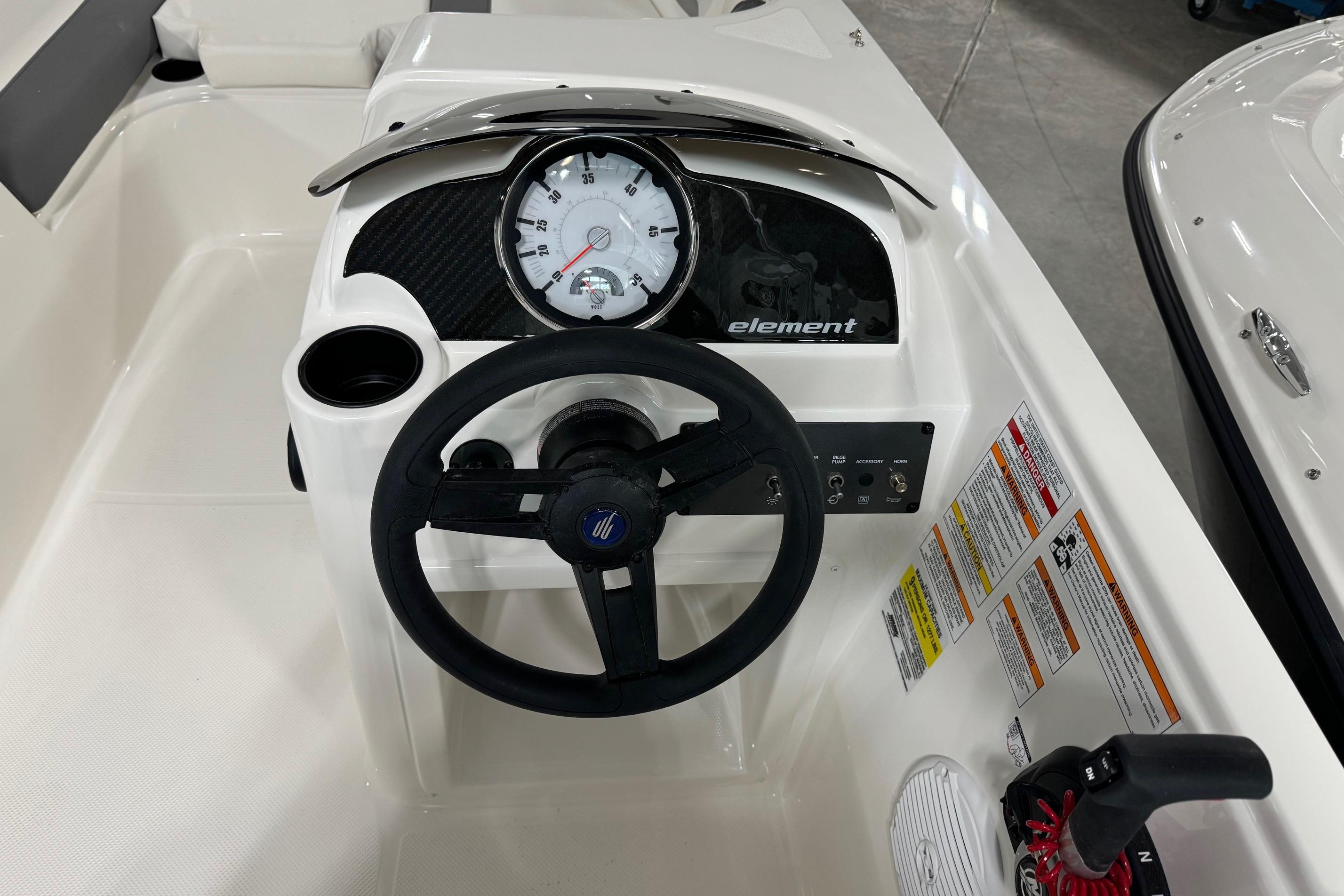 2025 Bayliner Element E18 dashboard with steering wheel and control panel.