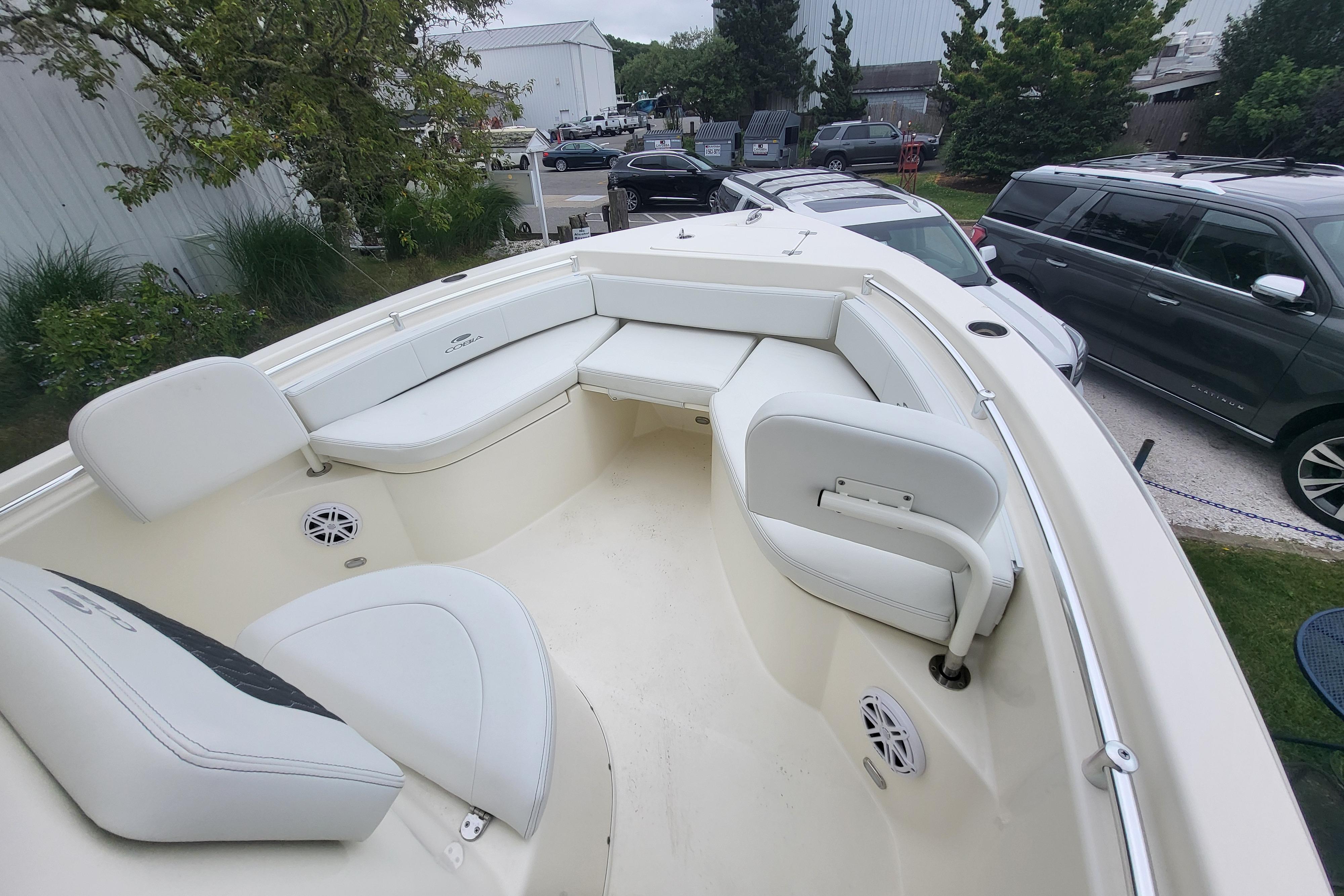 2025 Cobia 220 Center Console boat with spacious seating and modern design.