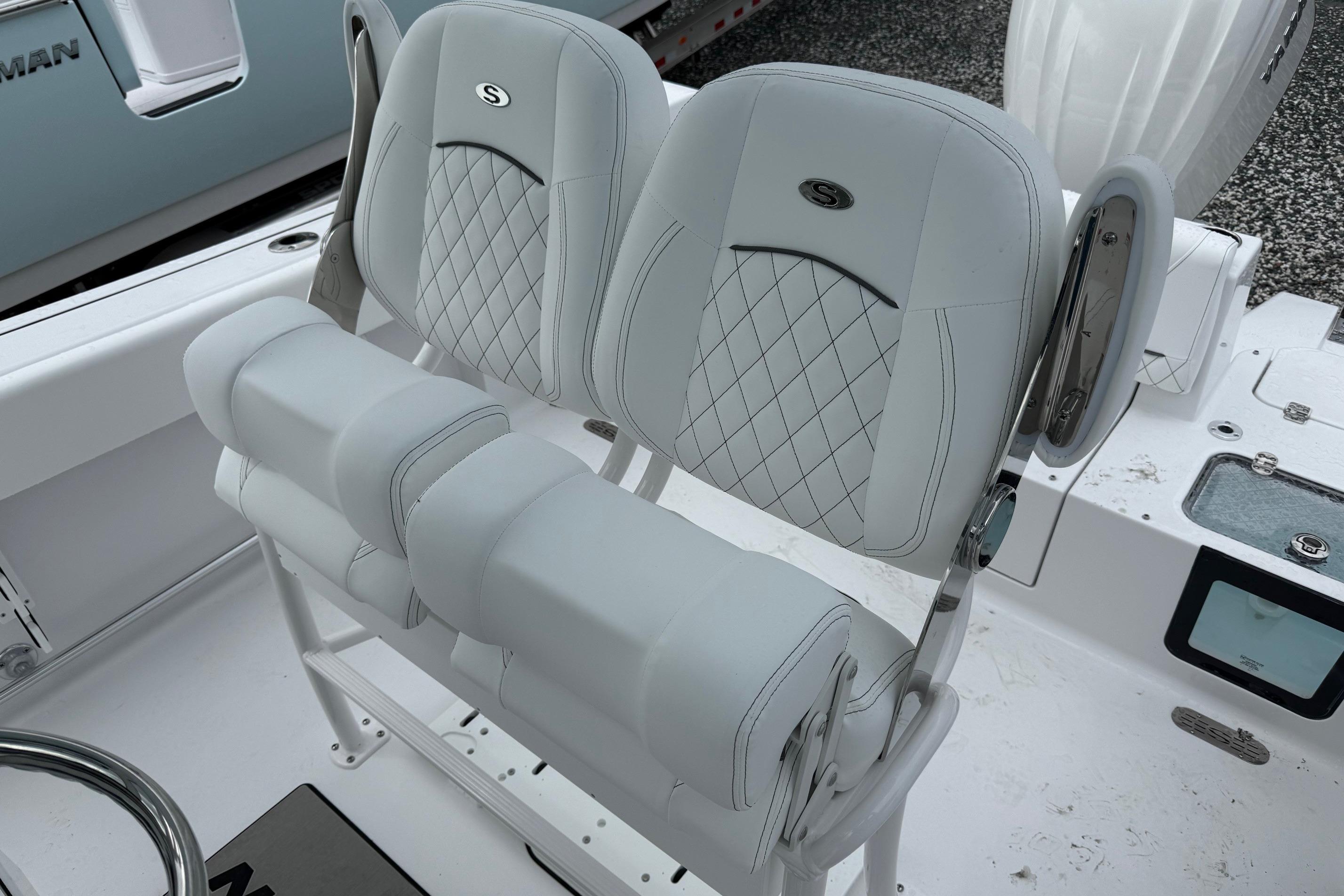 2026 Sportsman Heritage 231 Center Console boat seats with diamond stitching and armrests.