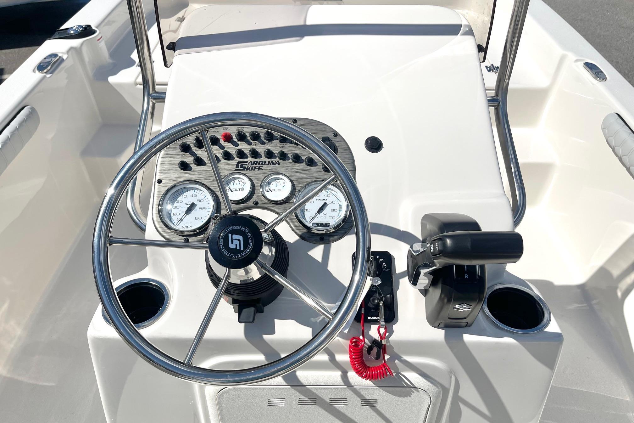 2026 Carolina Skiff 19 LS boat dashboard with steering wheel and controls.