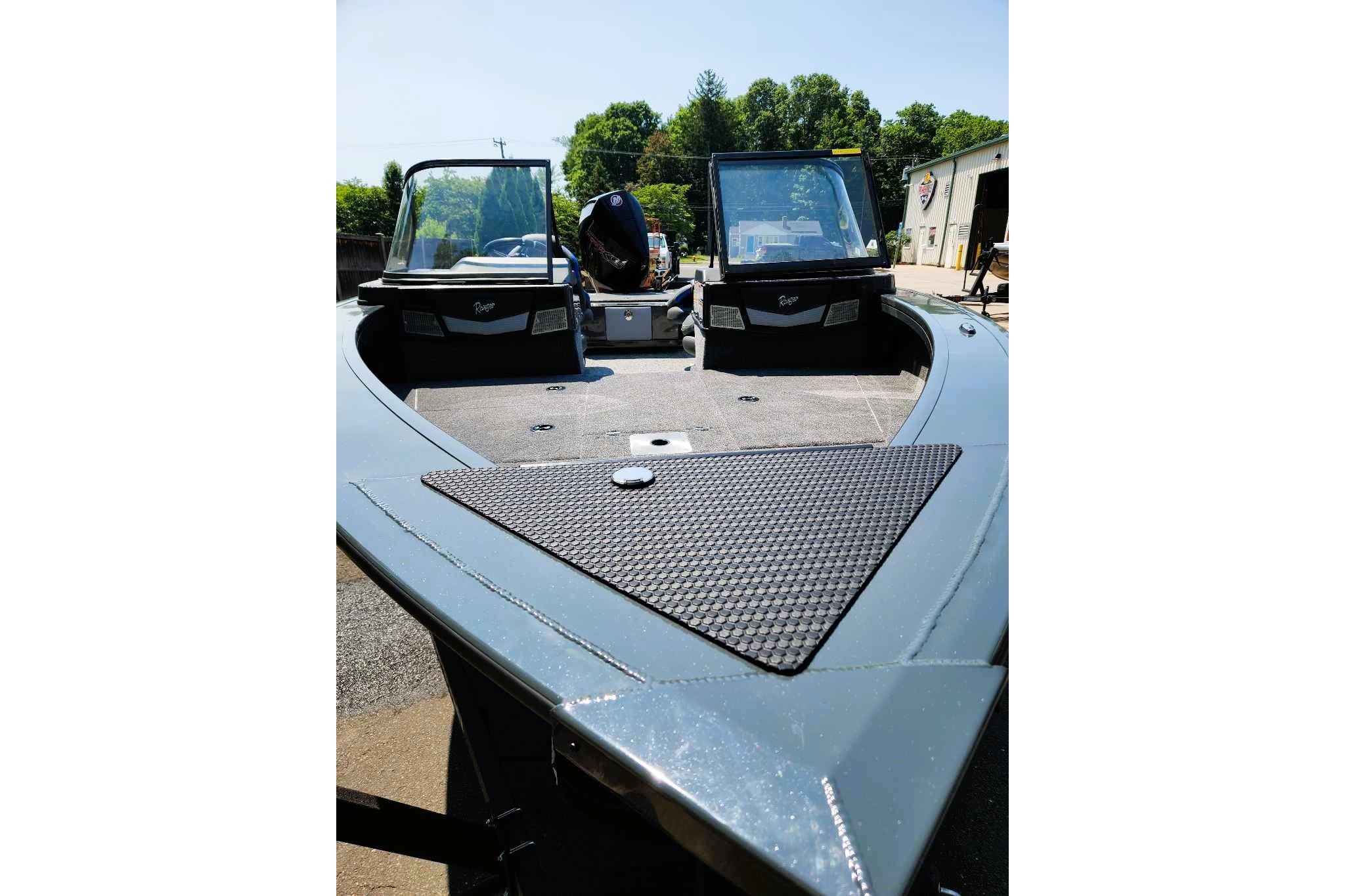 2026 Ranger VX1988 WT boat with dual windshields, parked outdoors on a sunny day.