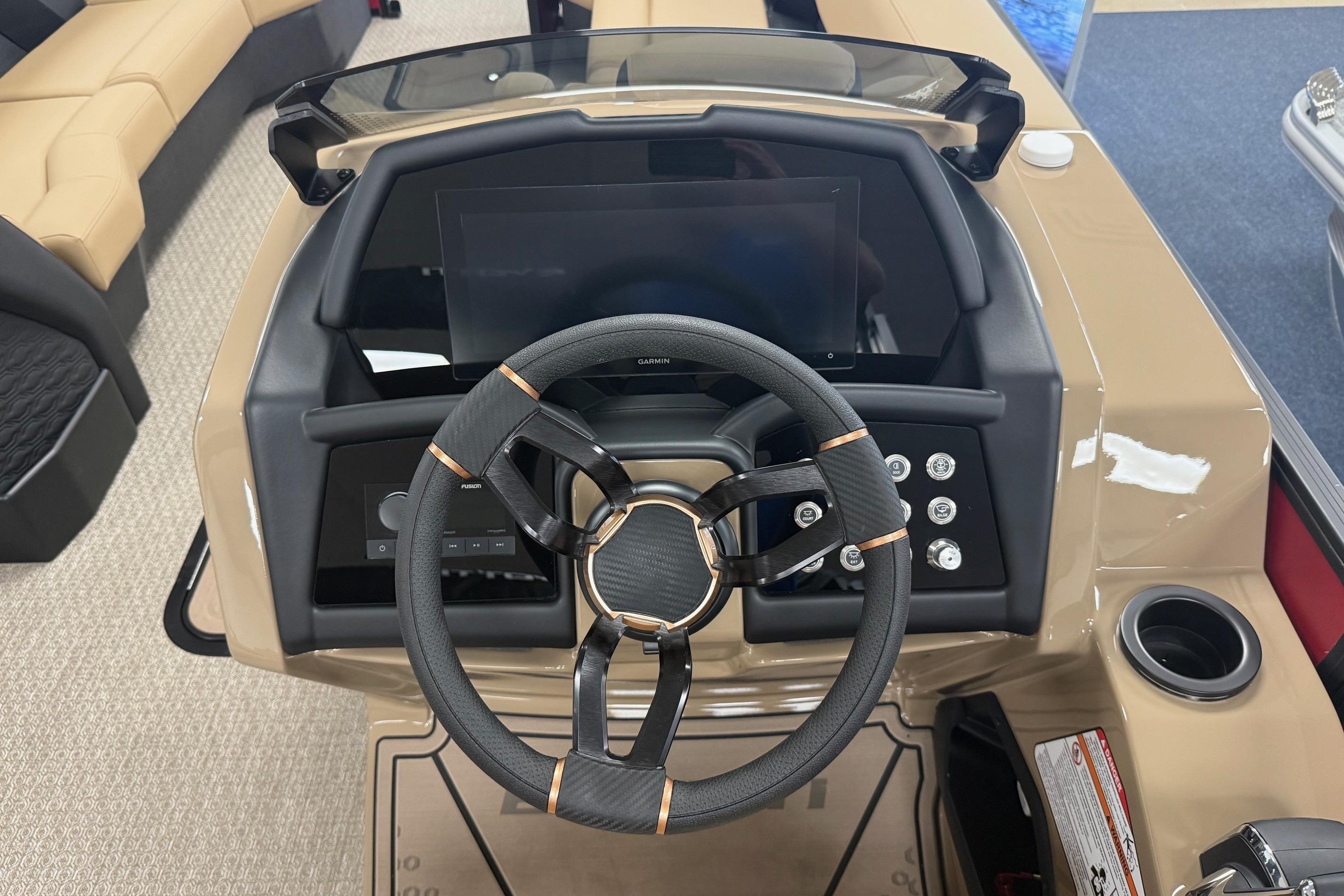 Steering console of 2026 Evotti 725CS boat with modern controls and dashboard.