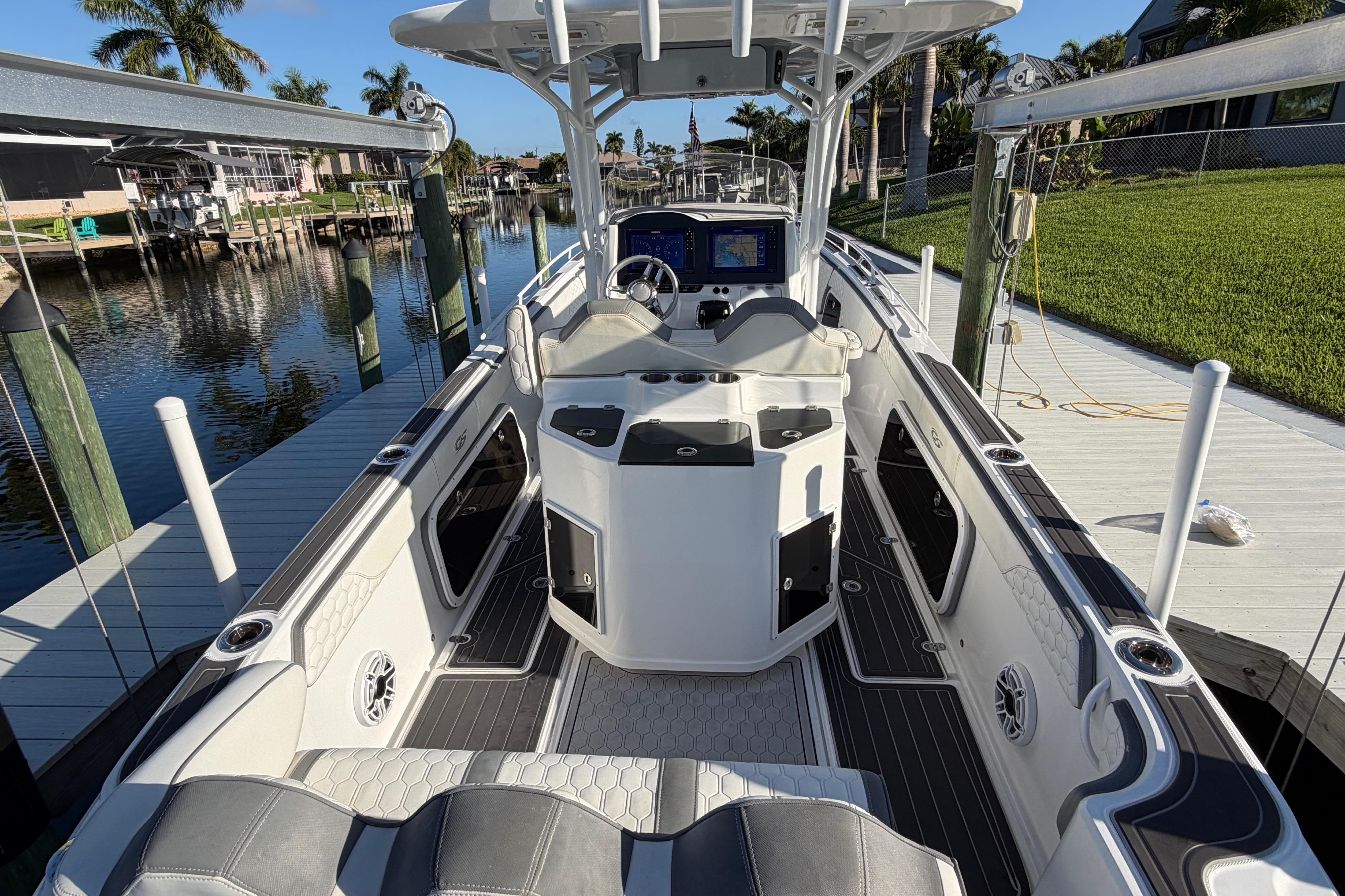 2022 Glasstream 328 Pro-XS boat docked, featuring sleek interior and advanced navigation system.