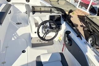 2026 Tahoe T21 boat interior with steering wheel and control panel.
